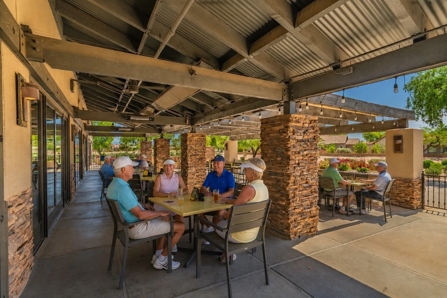 Guests dining on the outdoor patio at Slate Bistro overlooking Power Ranch Golf Club in Gilbert, Arizona.