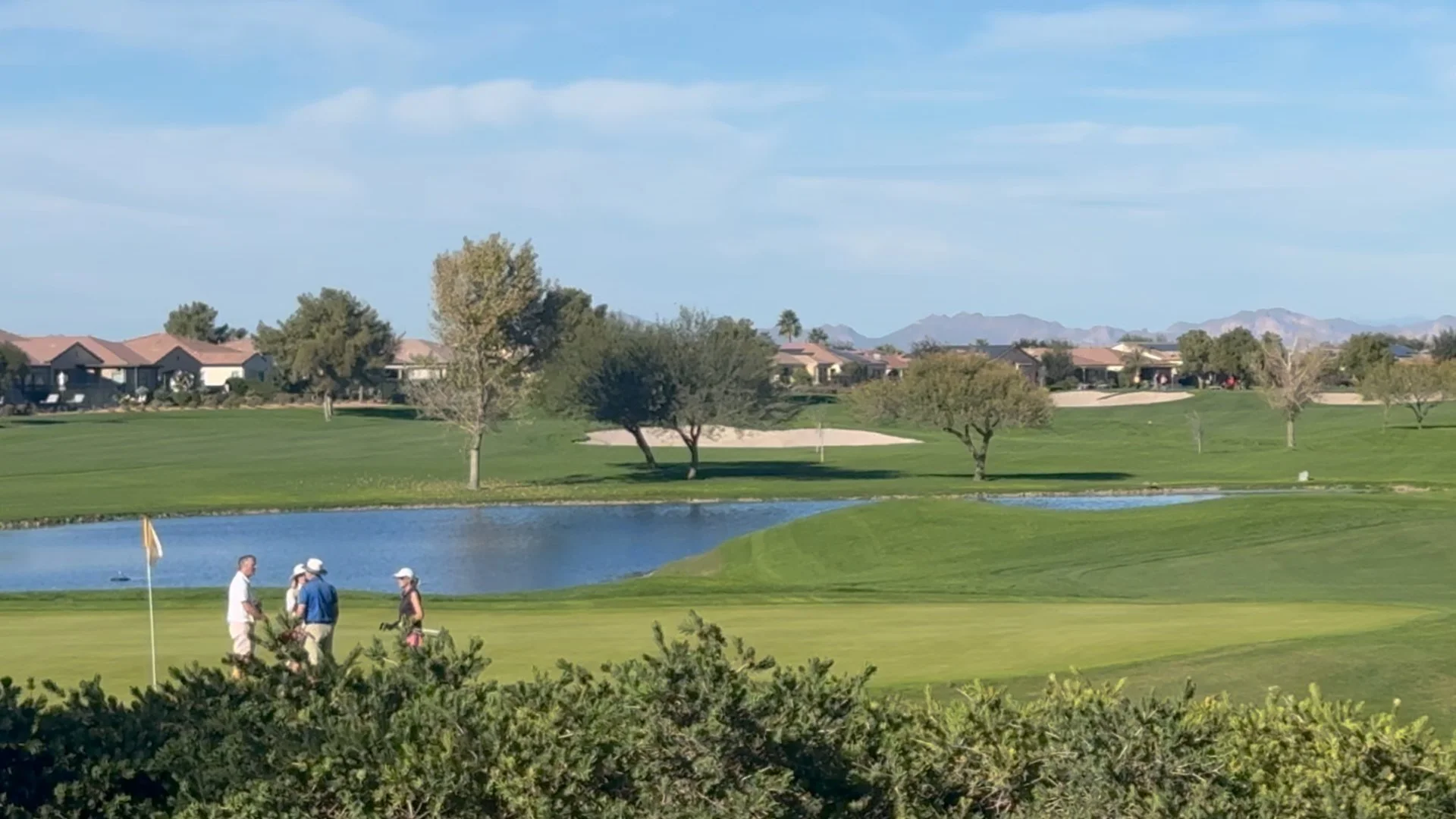 Residents enjoying golf and lake views at Encanterra in Queen Creek, Arizona.