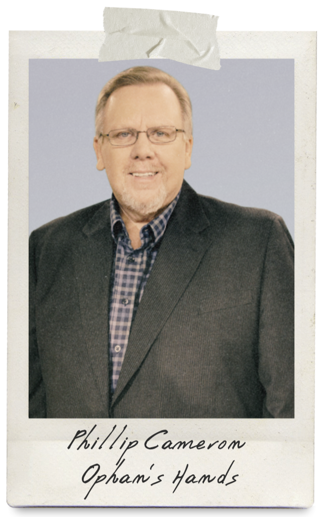 man with a suit smiling