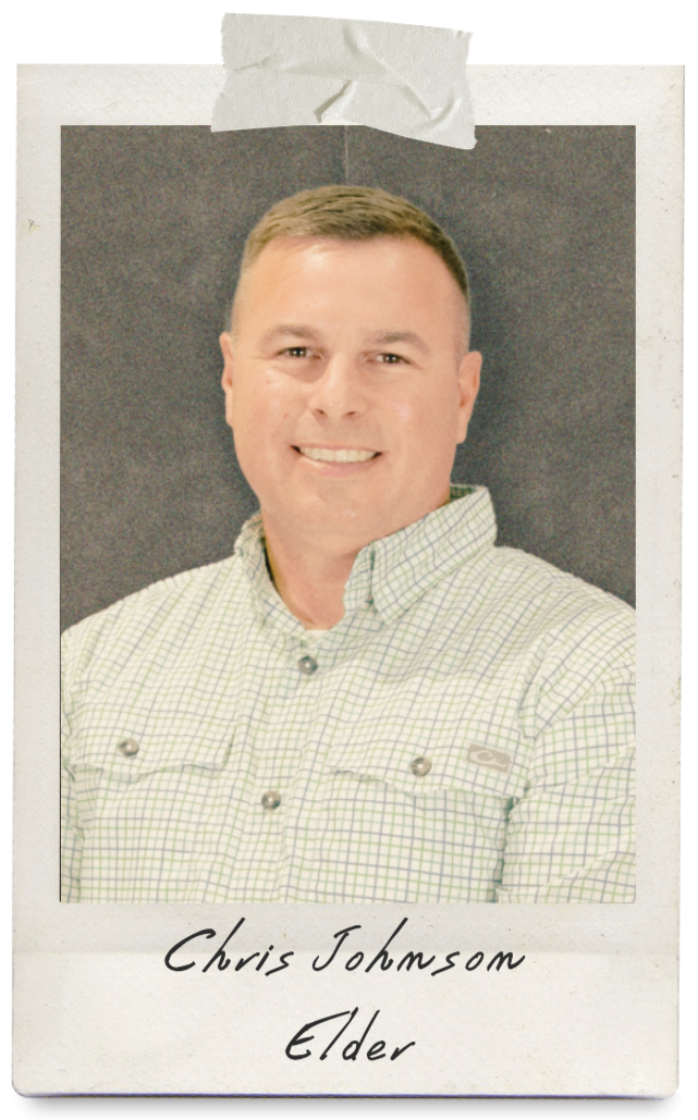 man wearing plaid shirt smiling