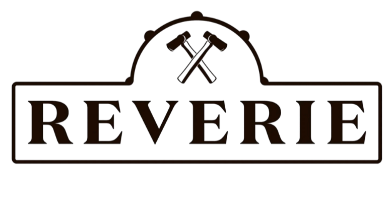 A logo with the word 'REVERIE' in bold letters, featuring a pair of crossed hammers and a circular saw blade above the text.