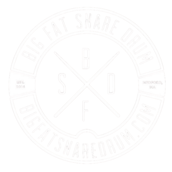 Circular logo with surrounding text 'Big Fat Snare Drum' and website 'bigfatsnaredrum.com'. Inside, a circle with the words 'B', 'S', 'D', and 'F' separated by two crossed drumsticks, with small text indicating 'Est. 2014' and 'Medford, MA'.