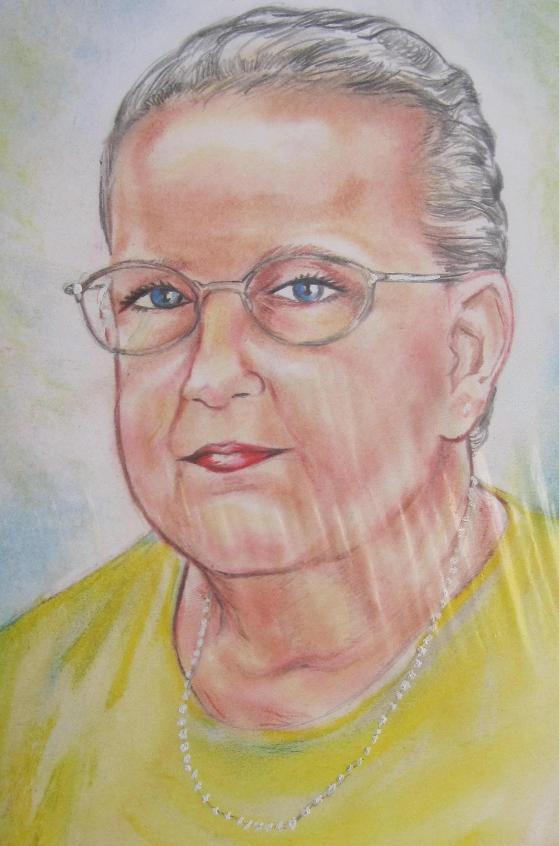 A colored pencil drawing of an elderly woman with gray hair, wearing glasses, a yellow blouse, pearl earrings, and a pearl necklace.