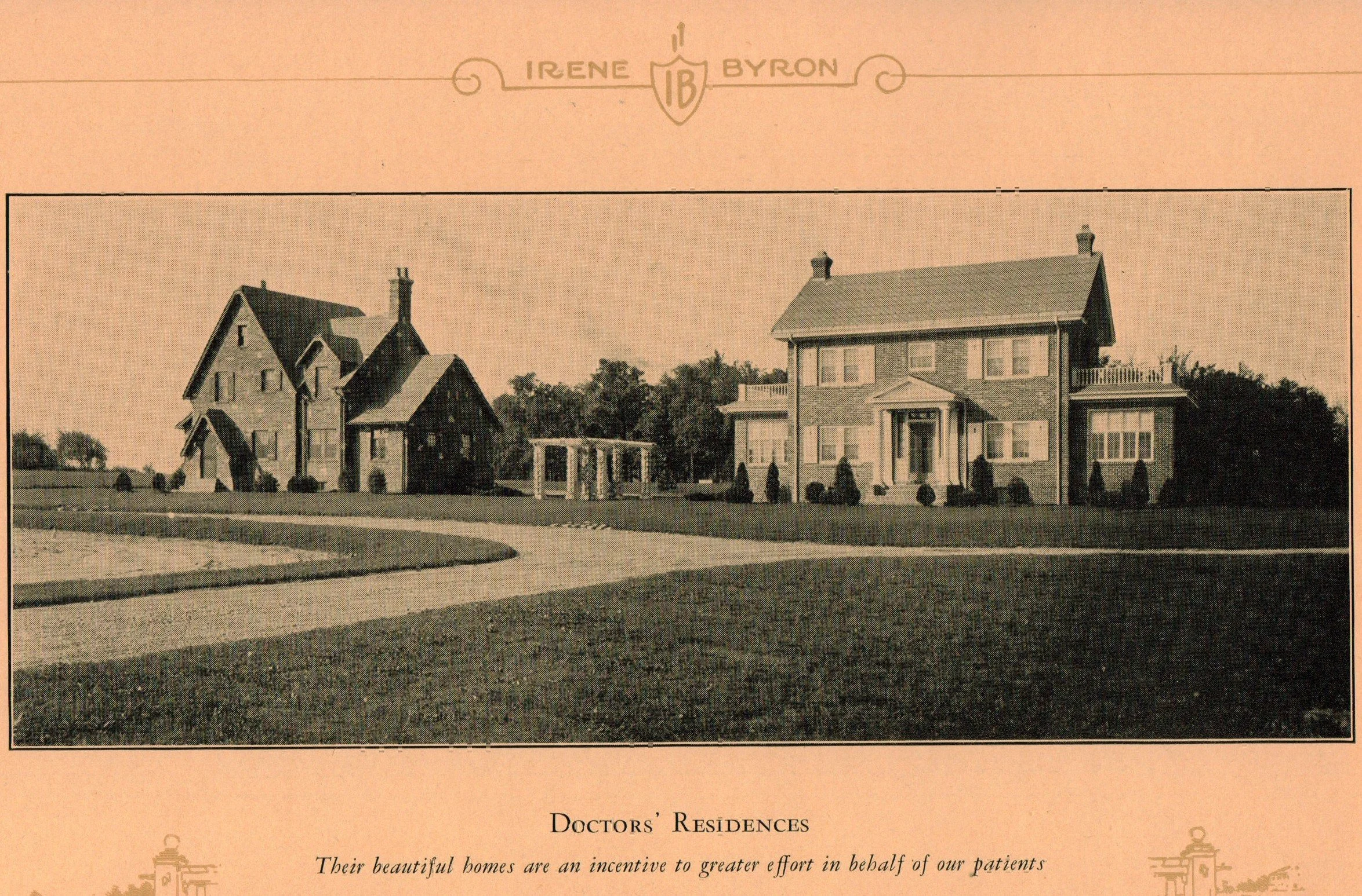 A black-and-white photograph of two large houses labeled as doctors' residences, surrounded by well-maintained lawns and trees, with a curved driveway in the foreground.