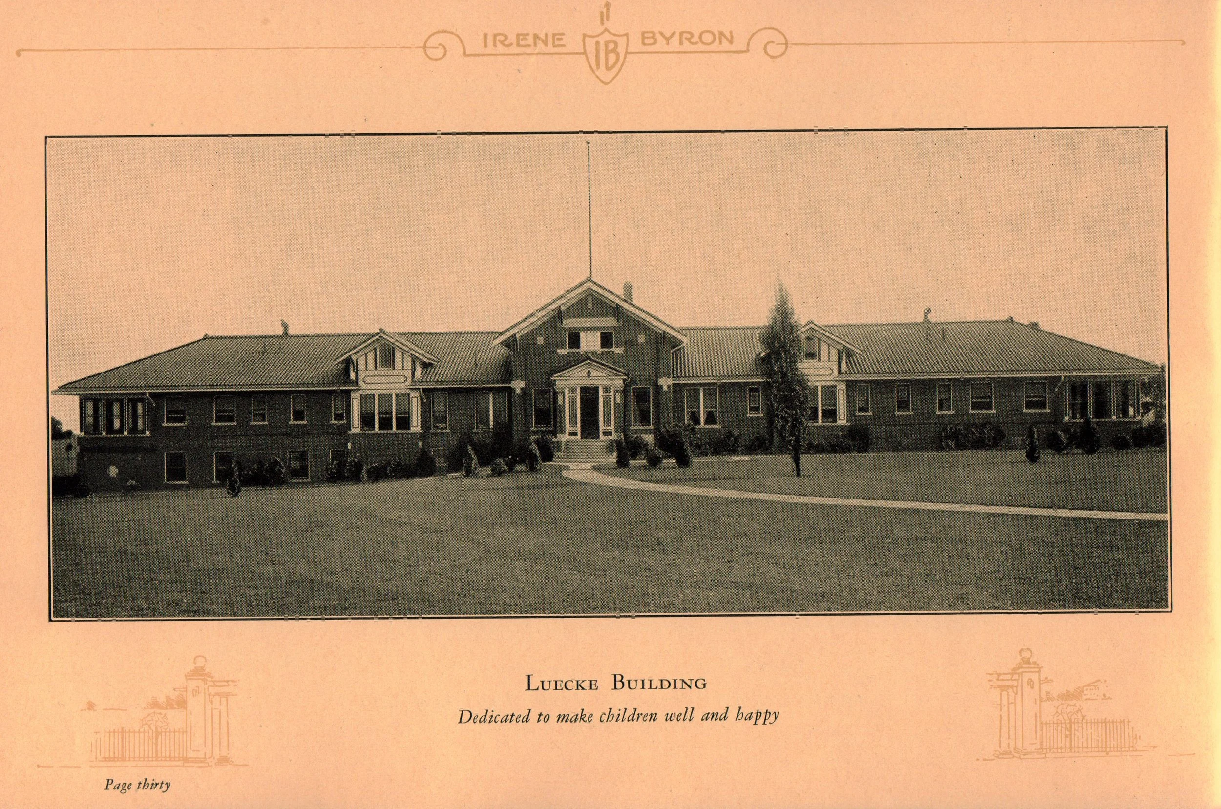 A black and white photograph of the Luecke Building with a large front lawn and a pathway leading to the entrance. The building has a symmetrical design with a central gabled section, multiple windows, and a porch at the entrance. There are a few trees and bushes in front of the building. The photograph is part of a page from a publication, with the text underneath reading: "Luecke Building - Dedicated to make children well and happy," and the page number "Page thirty." The header includes the name "Irene Byron" and an emblem with the initials "IB."