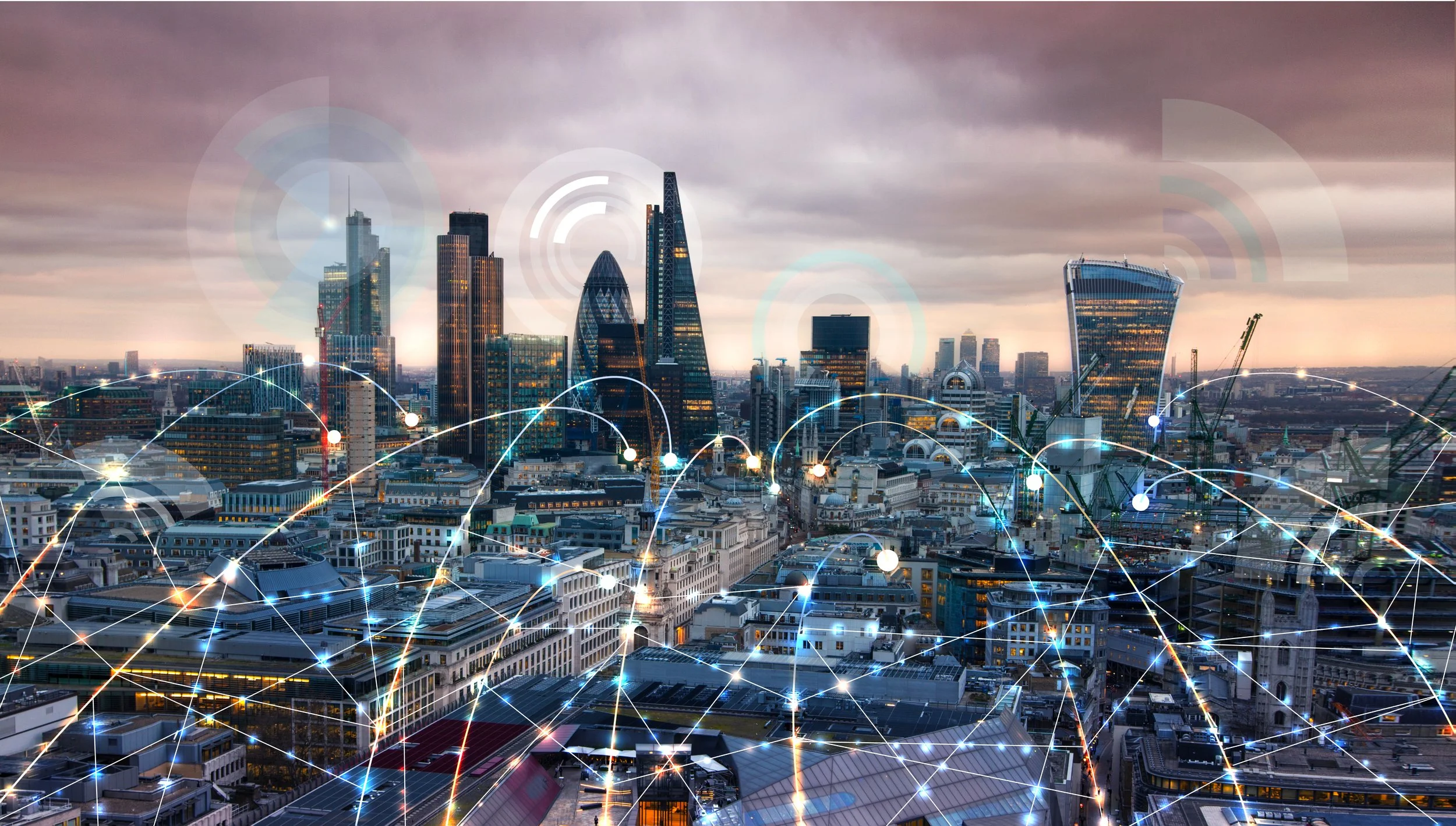 City skyline with modern skyscrapers and historic buildings, overlaid with digital network graphics representing connectivity.