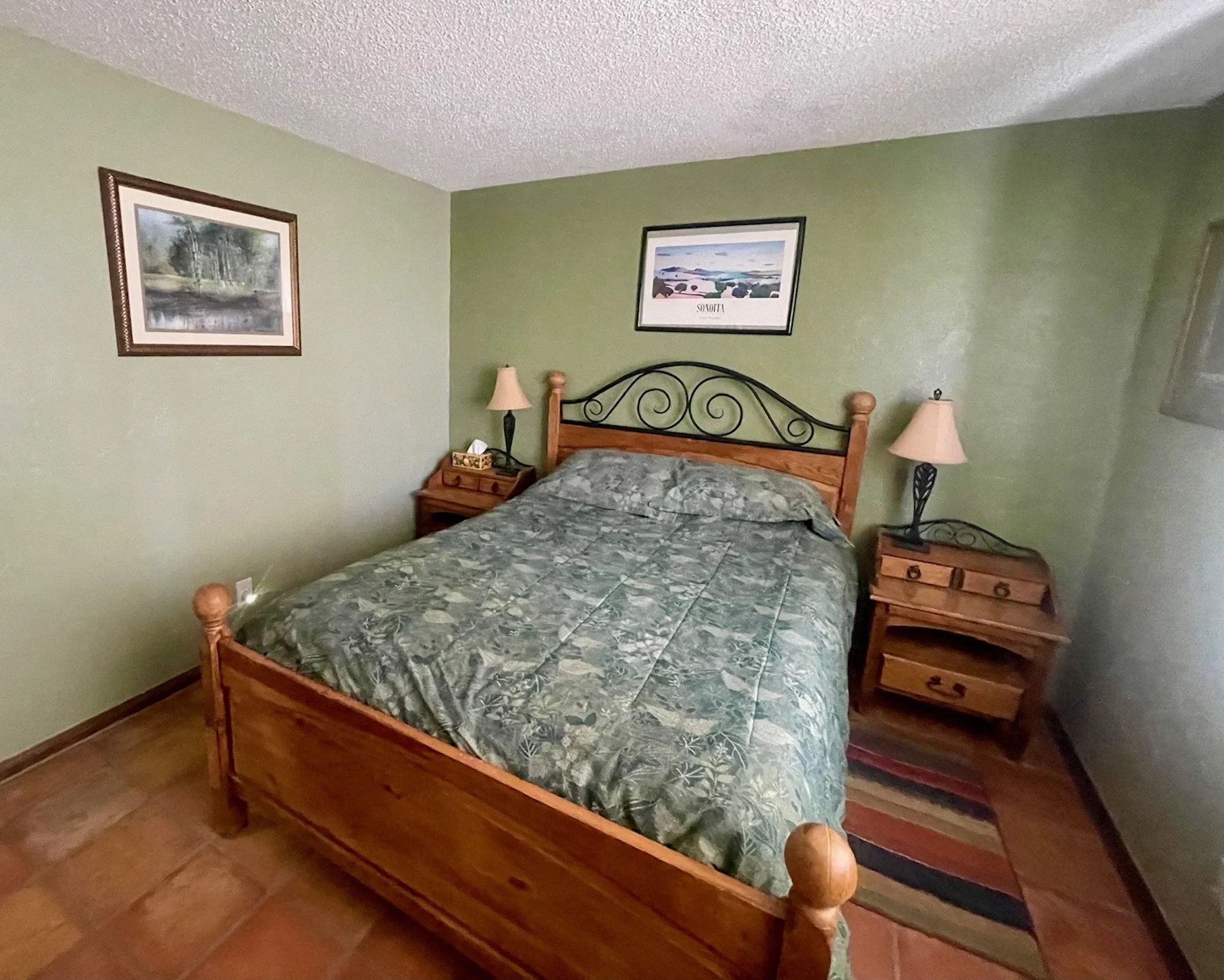Guest Bedroom

Cozy and Comfortable Guest Room
This inviting guest bedroom features a comfortable bed, soothing earth-tone décor, and charming Southwestern touches throughout. Thoughtfully furnished with bedside tables and warm lighting, it provides 