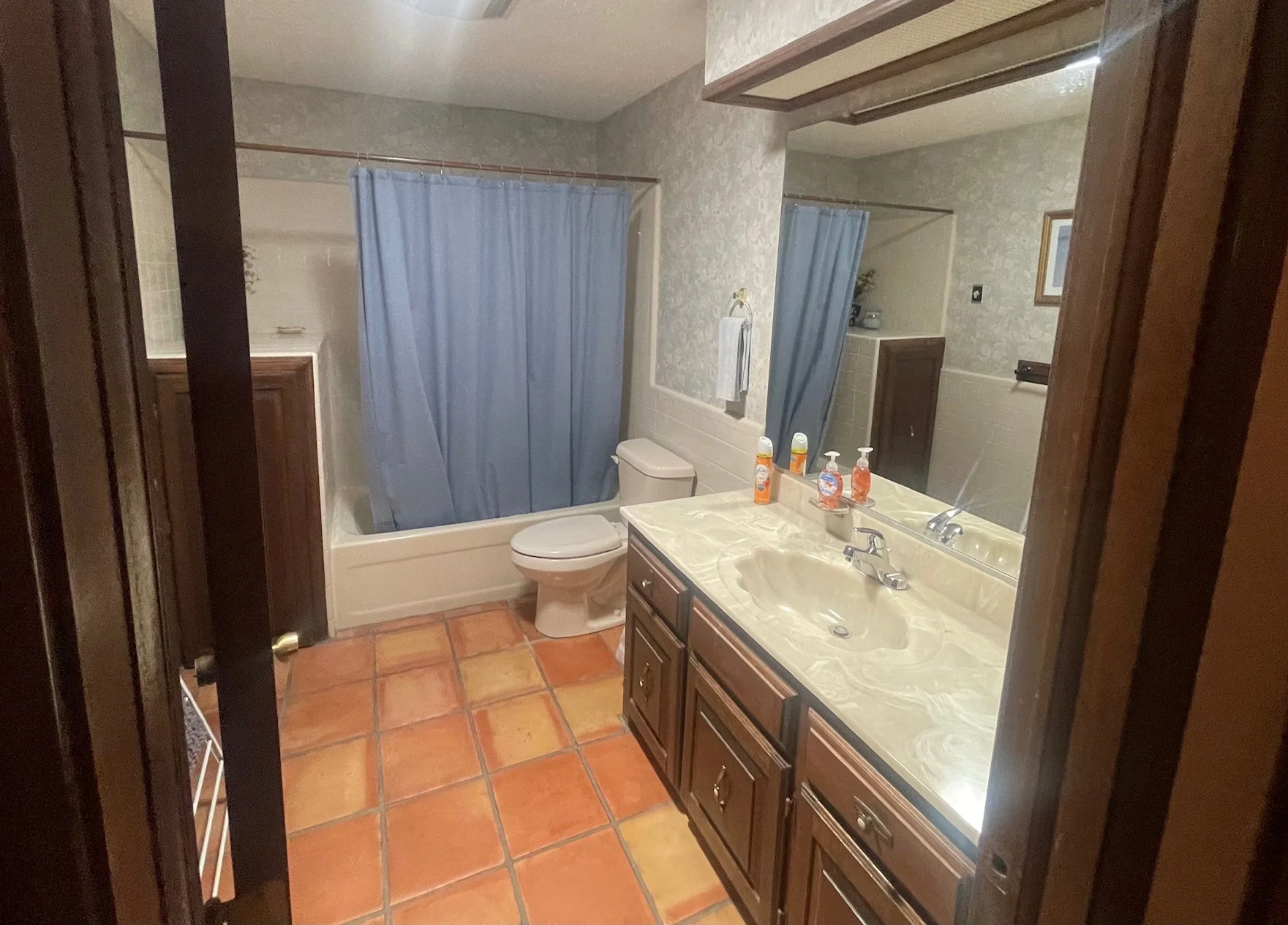 Master Bathroom

Spacious Private Retreat
The master bathroom offers plenty of room to unwind, featuring a large vanity, generous storage, and a full tub and shower combination. Warm tile flooring and classic Southwestern design elements create a rel