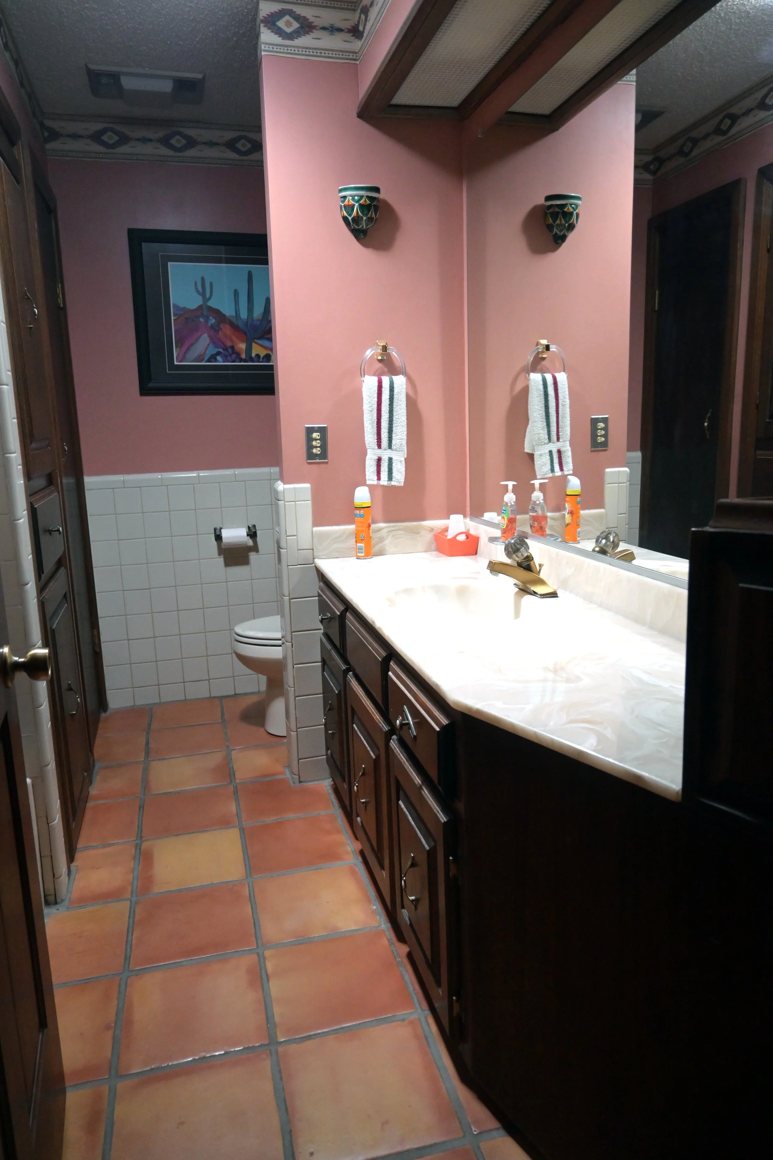 Guest Bathroom

Southwestern Charm Meets Everyday Comfort
This guest bathroom features warm desert-inspired colors, traditional Saltillo tile flooring, and a spacious vanity with ample counter space. Southwestern accents and decorative touches create