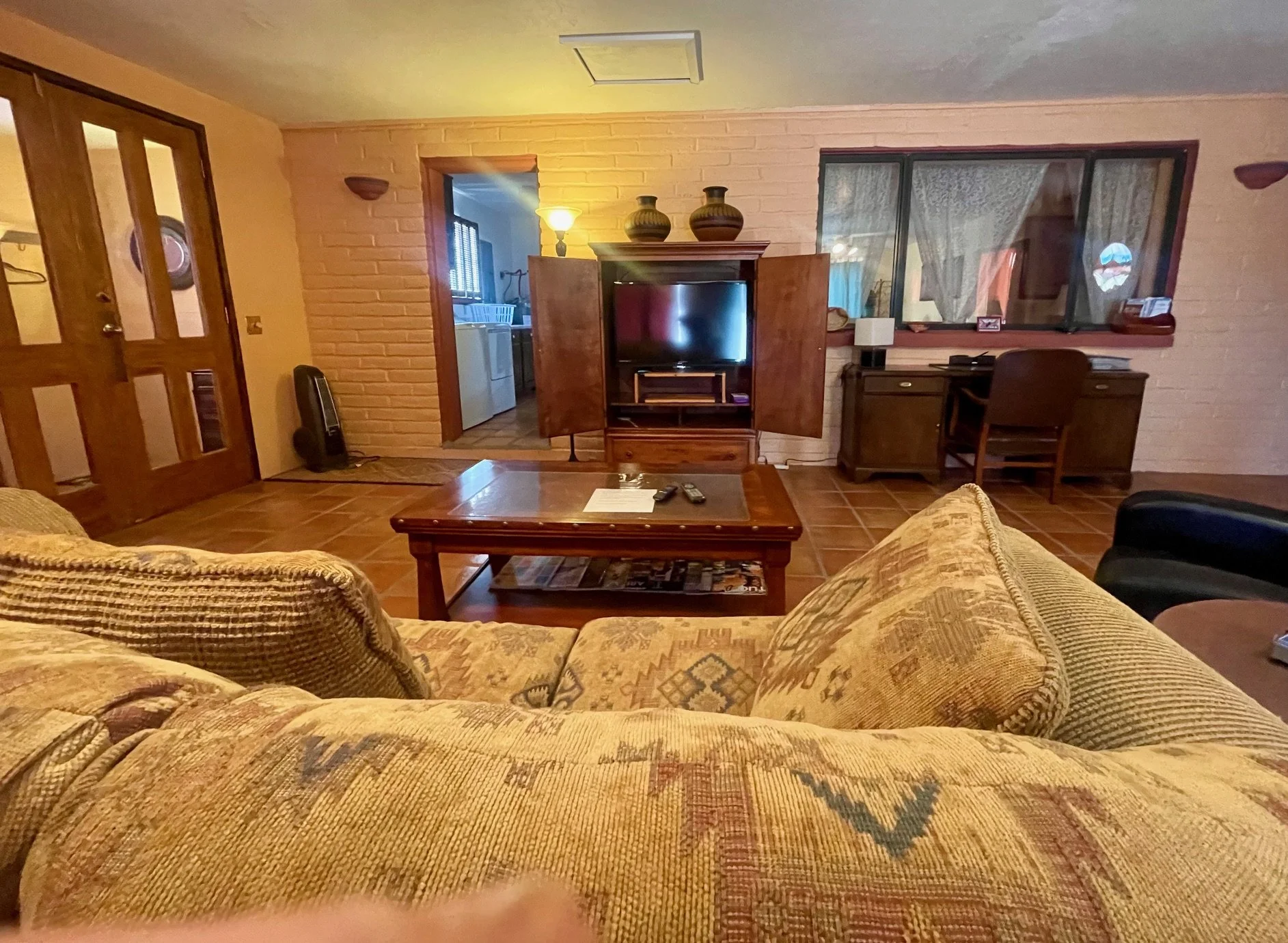 Arizona Room / Sunroom

Bright Arizona Room with Lounge Seating and Workspace
This spacious Arizona Room offers a comfortable retreat filled with Southwestern charm. Relax on the cozy seating while watching your favorite shows, enjoy a quiet morning 