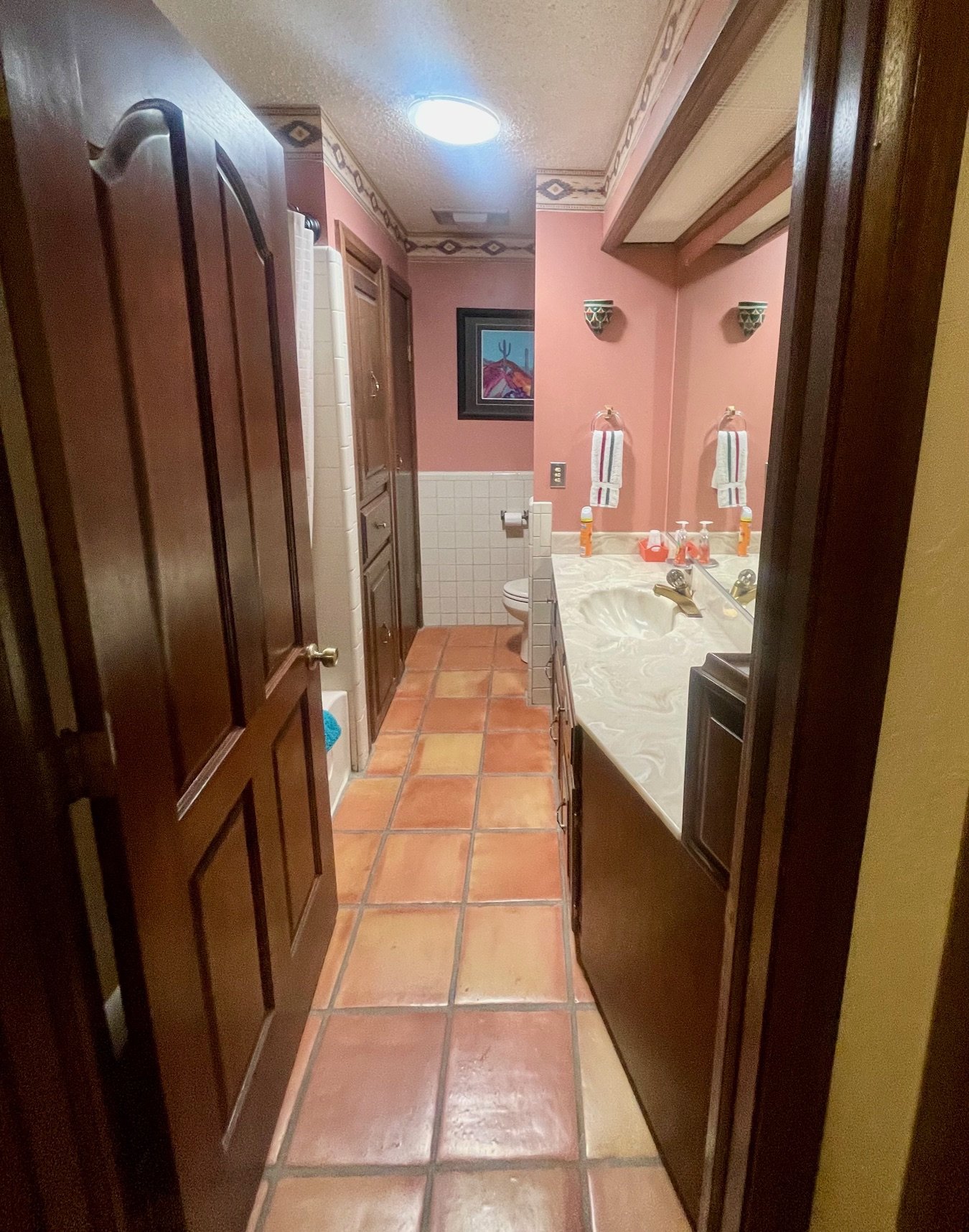 Guest Bathroom (Alternate View)

Well-Appointed Guest Bath
This inviting guest bathroom showcases traditional Southwestern details, including warm earth tones, Saltillo tile floors, and decorative accents inspired by the desert landscape. The spaciou