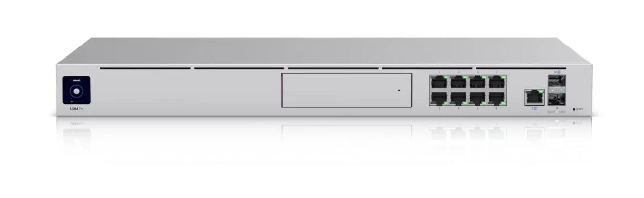A UniFi Dream Machine Pro router with multiple Ethernet ports and touchscreen.