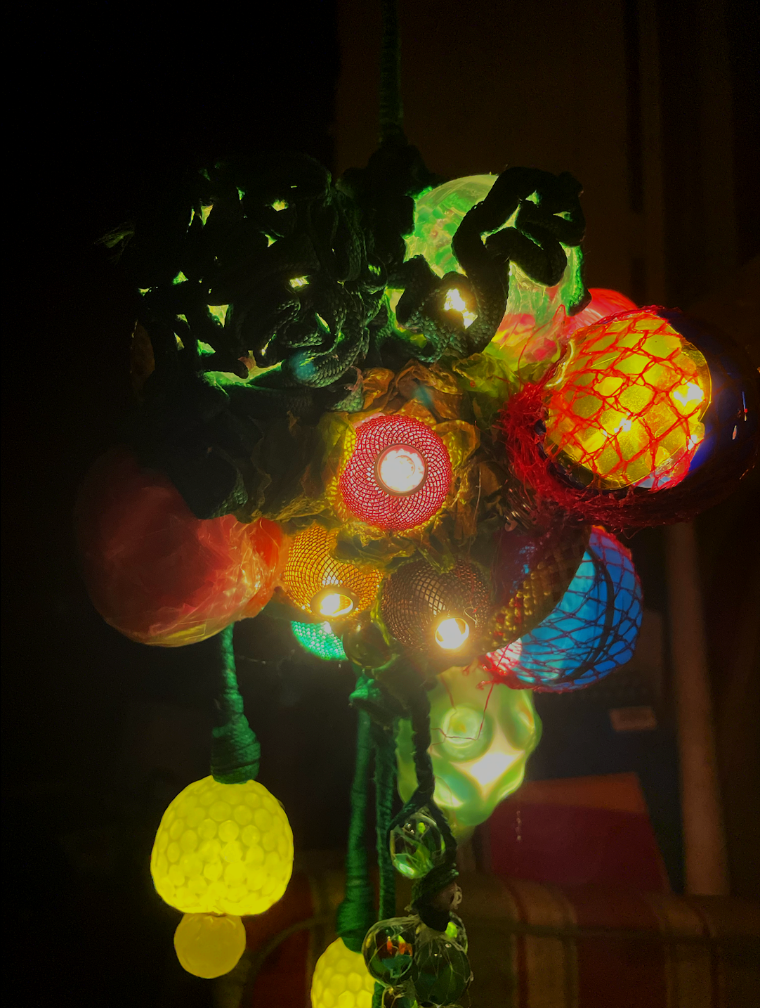 Hanging Lamp, found objects, beads, plastic, 3' x 2' , 2024