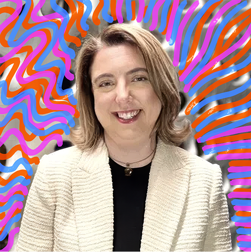 A woman with shoulder-length brown hair smiling, wearing a cream-colored blazer over a black top, with colorful wavy lines in pink, purple, orange, and blue in the background.
