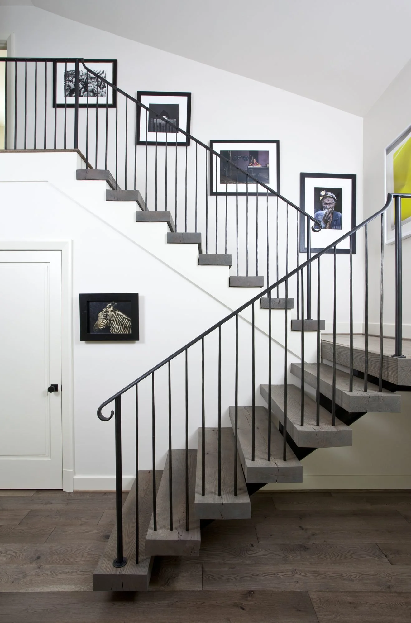 millwalk-atlanta-residential-interior-design-staircase-wide-view-gallery-wall-floating-treads.jpg