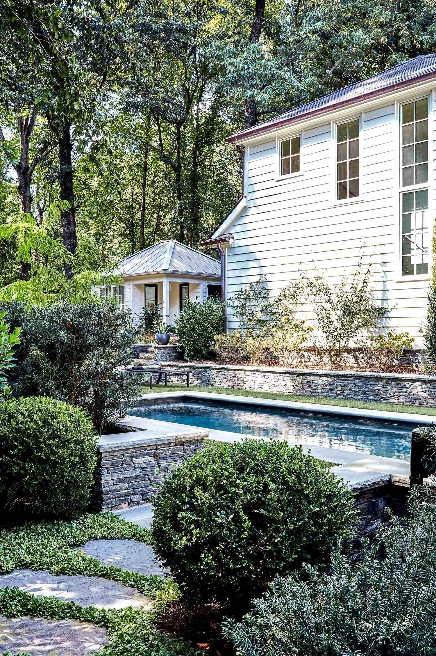 exterior-guest-house-atlanta-residential-interior-design-pool-garden-stone-wall-landscape.jpg