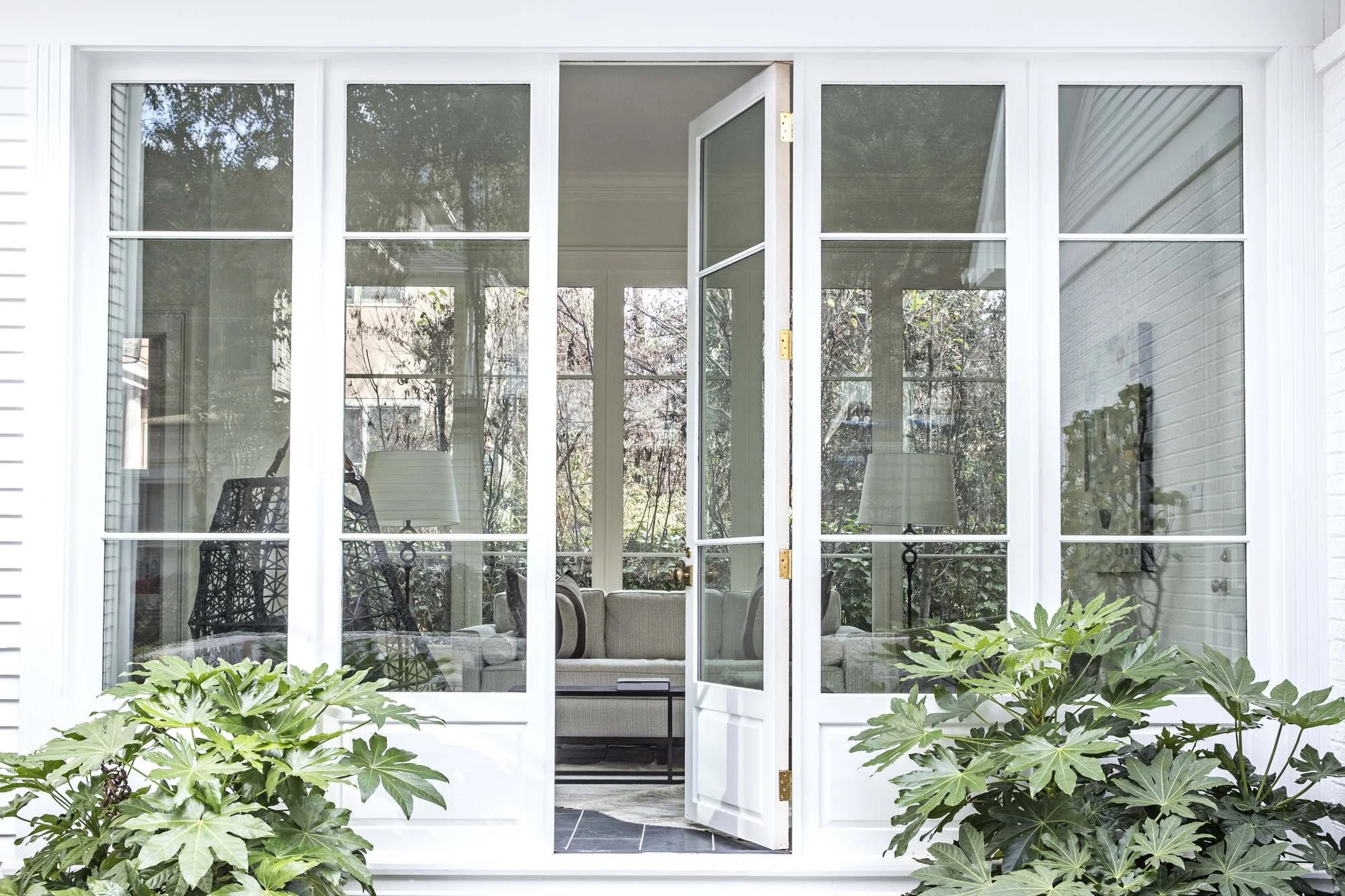 ansley-atlanta-residential-interior-design-french-doors-screened-porch-garden.jpg