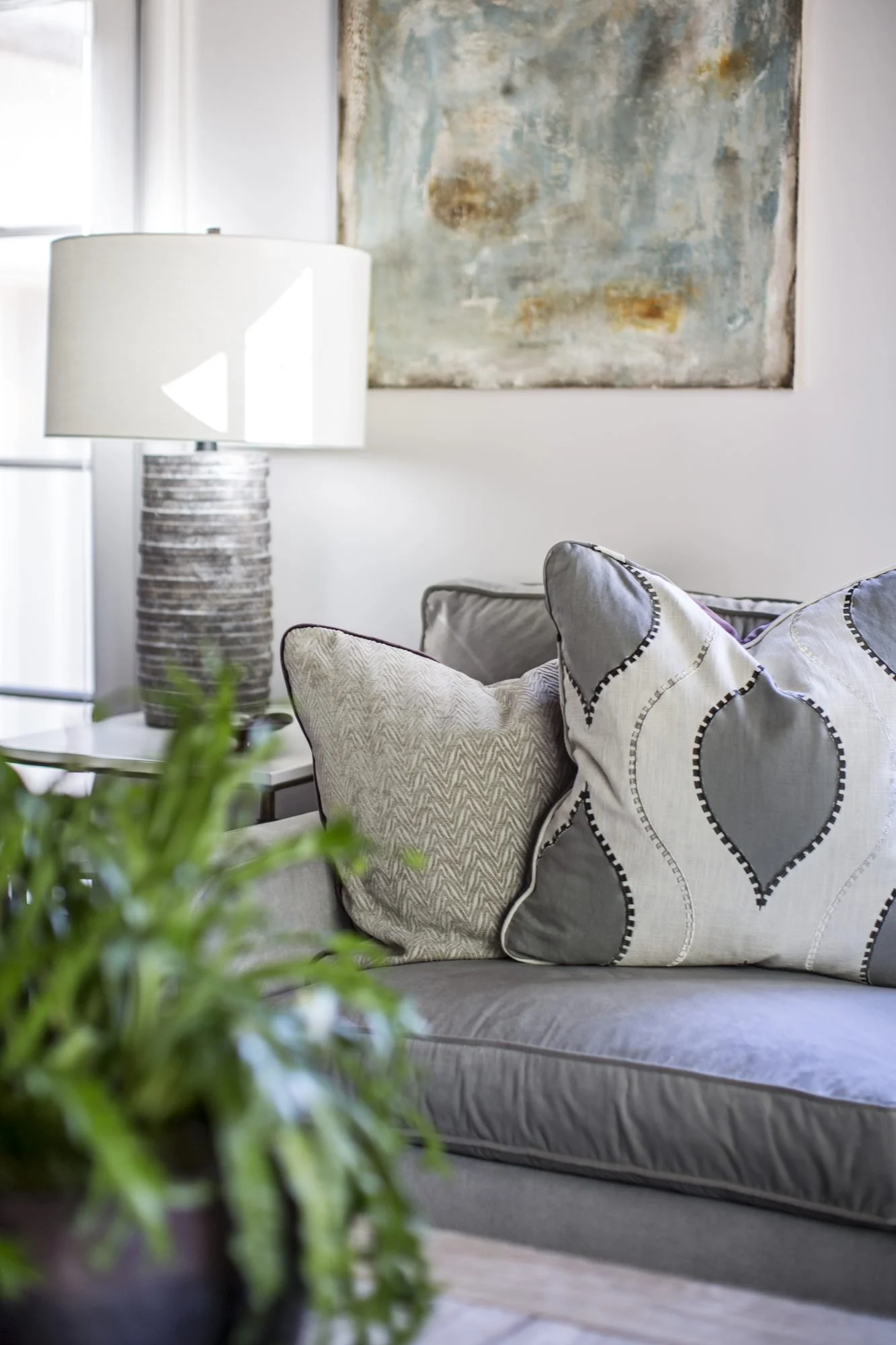 living-room-sofa-detail-decorative-pillows-abstract-art.jpg