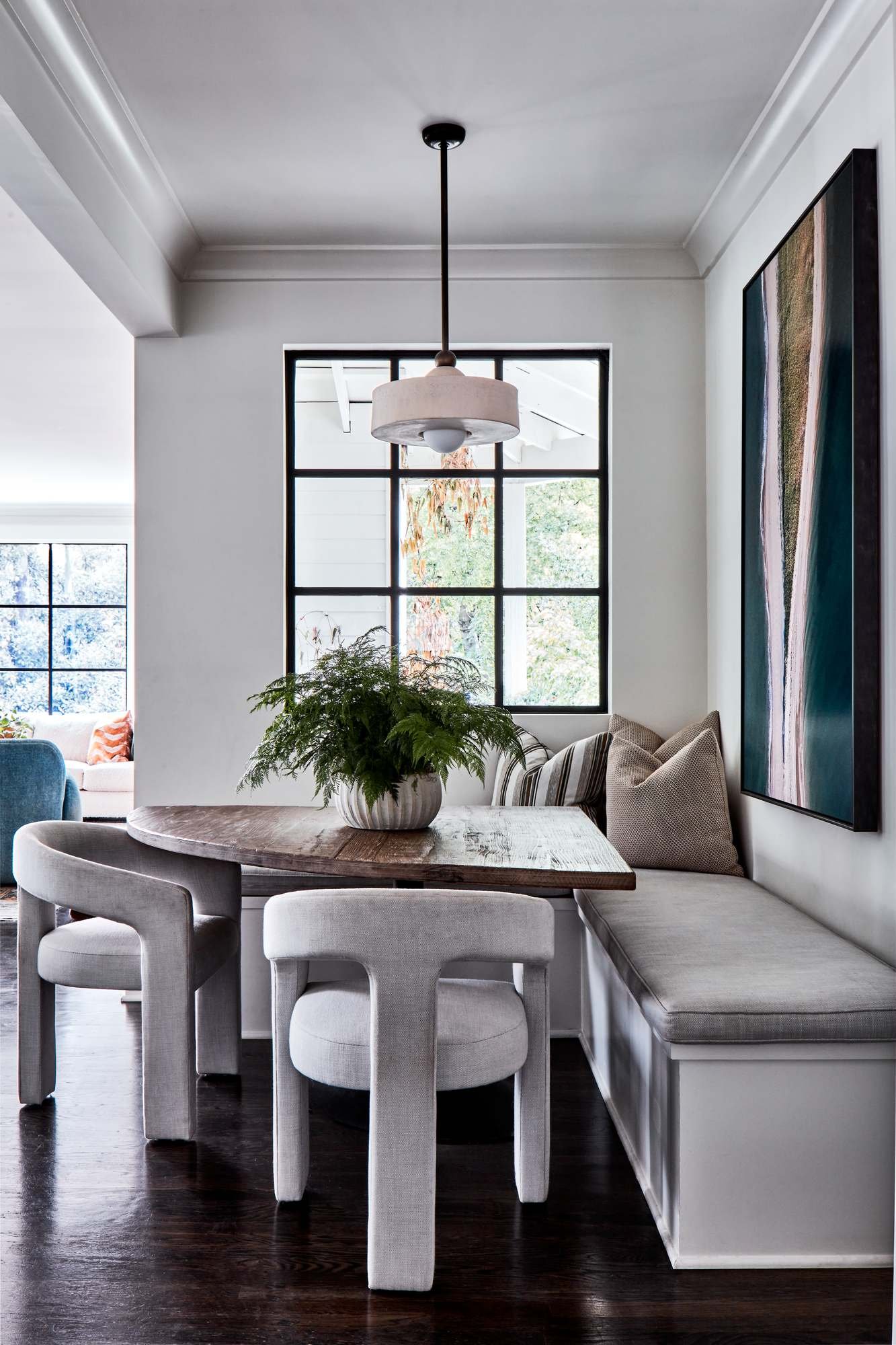 Woodward-Way-breakfast-nook-banquette-sculptural-chairs-fern-centerpiece.jpg