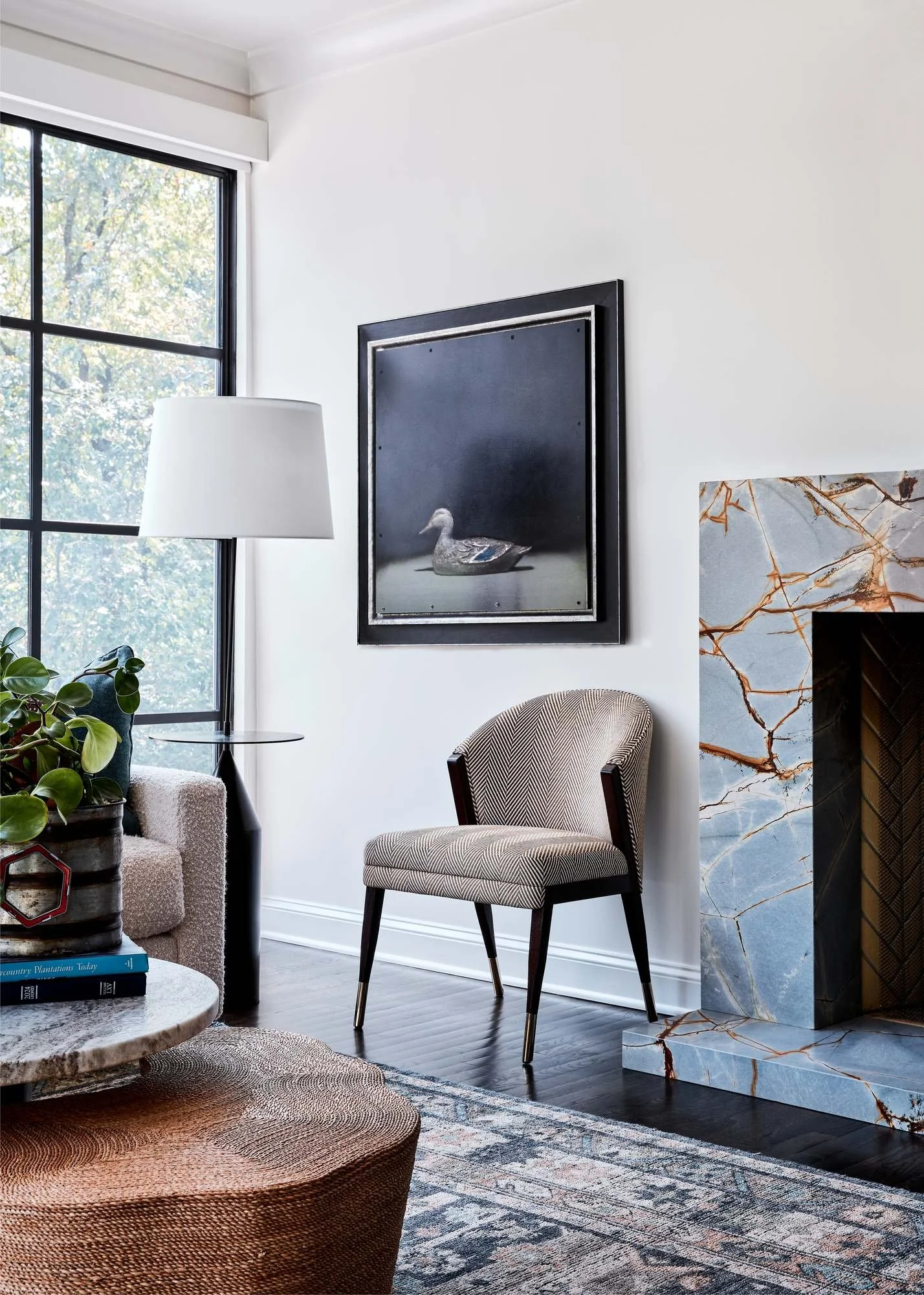 Woodward-Way-living-room-marble-fireplace-herringbone-chair-duck-art.jpg