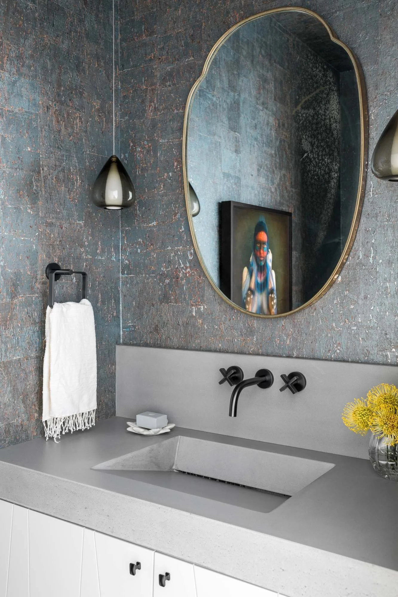 millwalk-atlanta-residential-interior-design-powder-room-textured-wallpaper-concrete-sink-oval-mirror.jpg