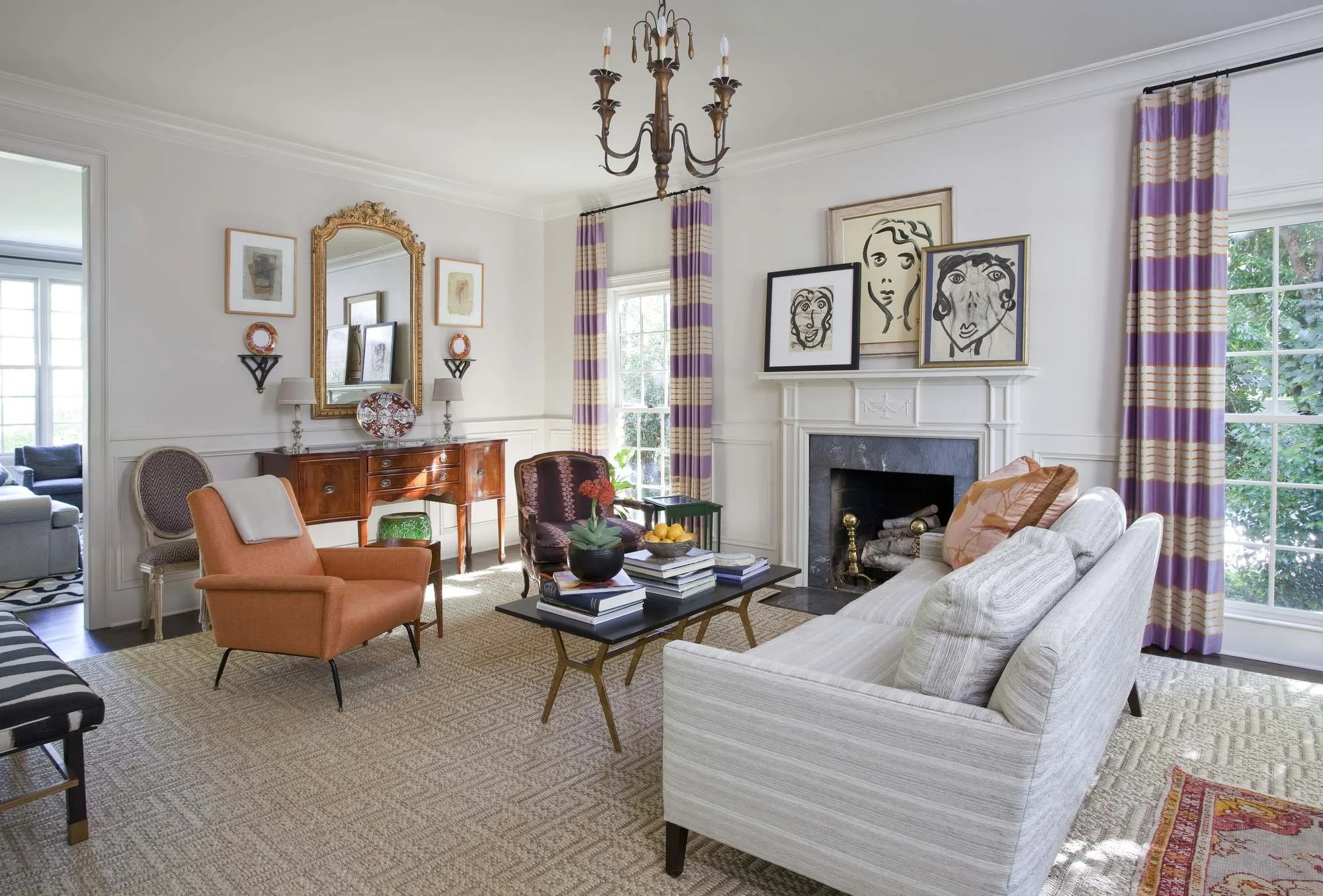 hanover-atlanta-residential-interior-design-living-room-purple-drapes-art-collection-fireplace.jpg