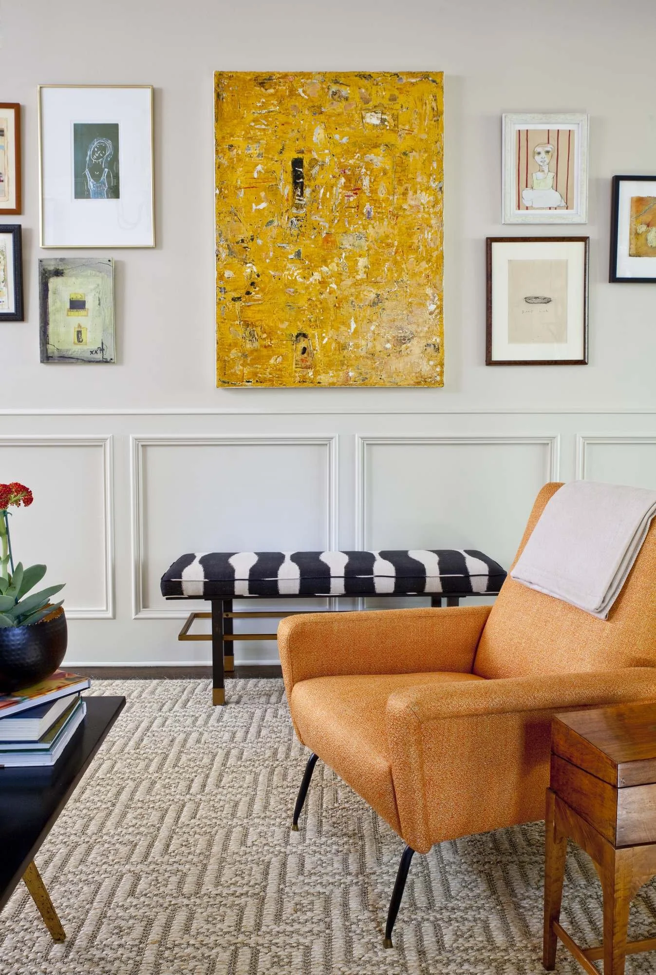 hanover-atlanta-residential-interior-design-living-room-gallery-wall-yellow-abstract-orange-chair.jpg