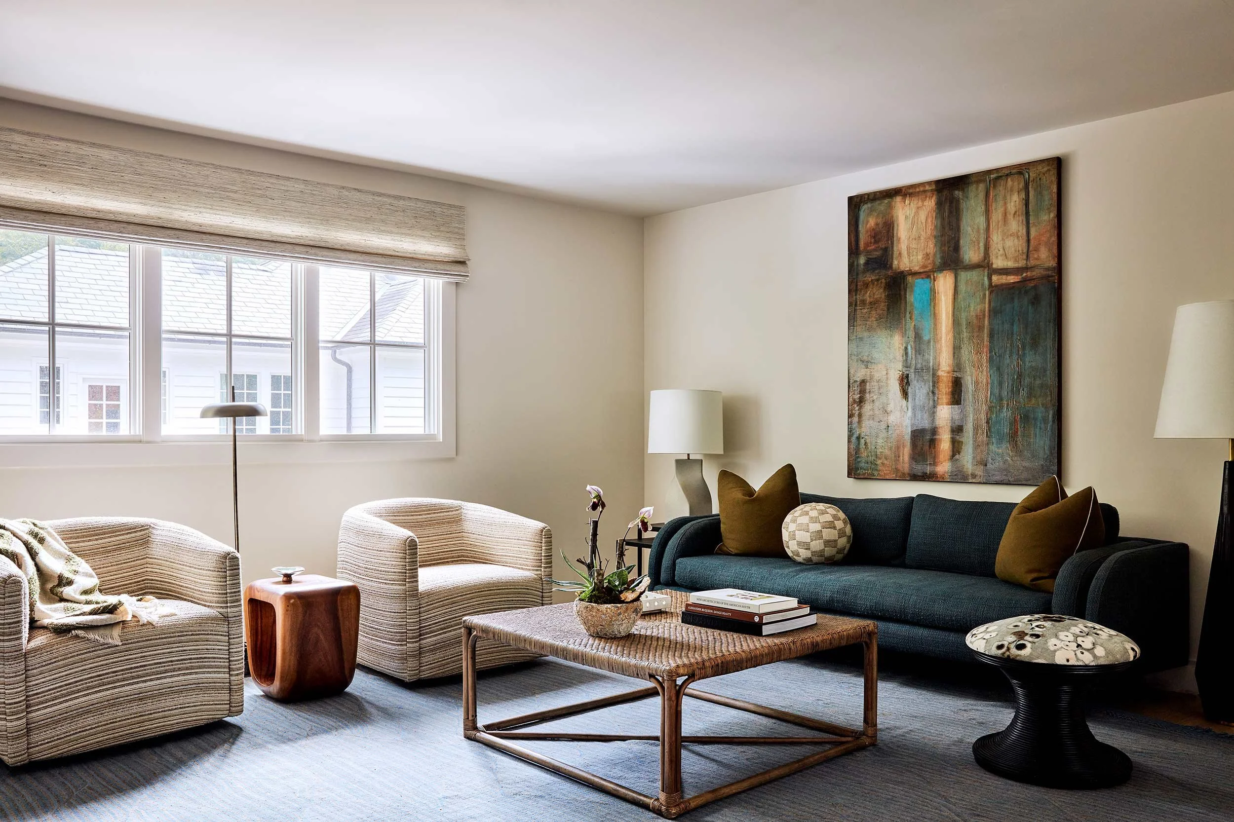 exterior-guest-house-atlanta-residential-interior-design-living-room-teal-sofa-abstract-art.jpg