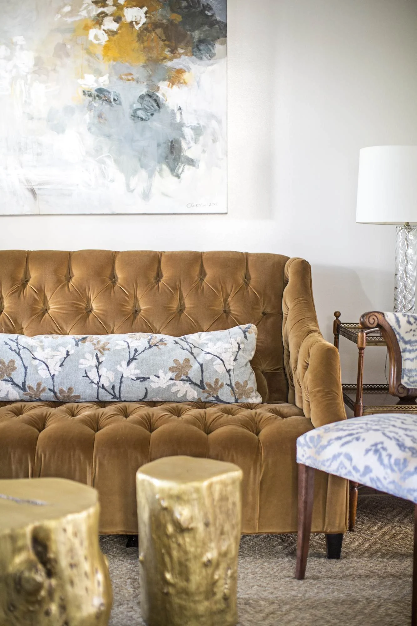 cofield-atlanta-residential-interior-design-sitting-room-tufted-camel-sofa-gold-stump-tables.jpg