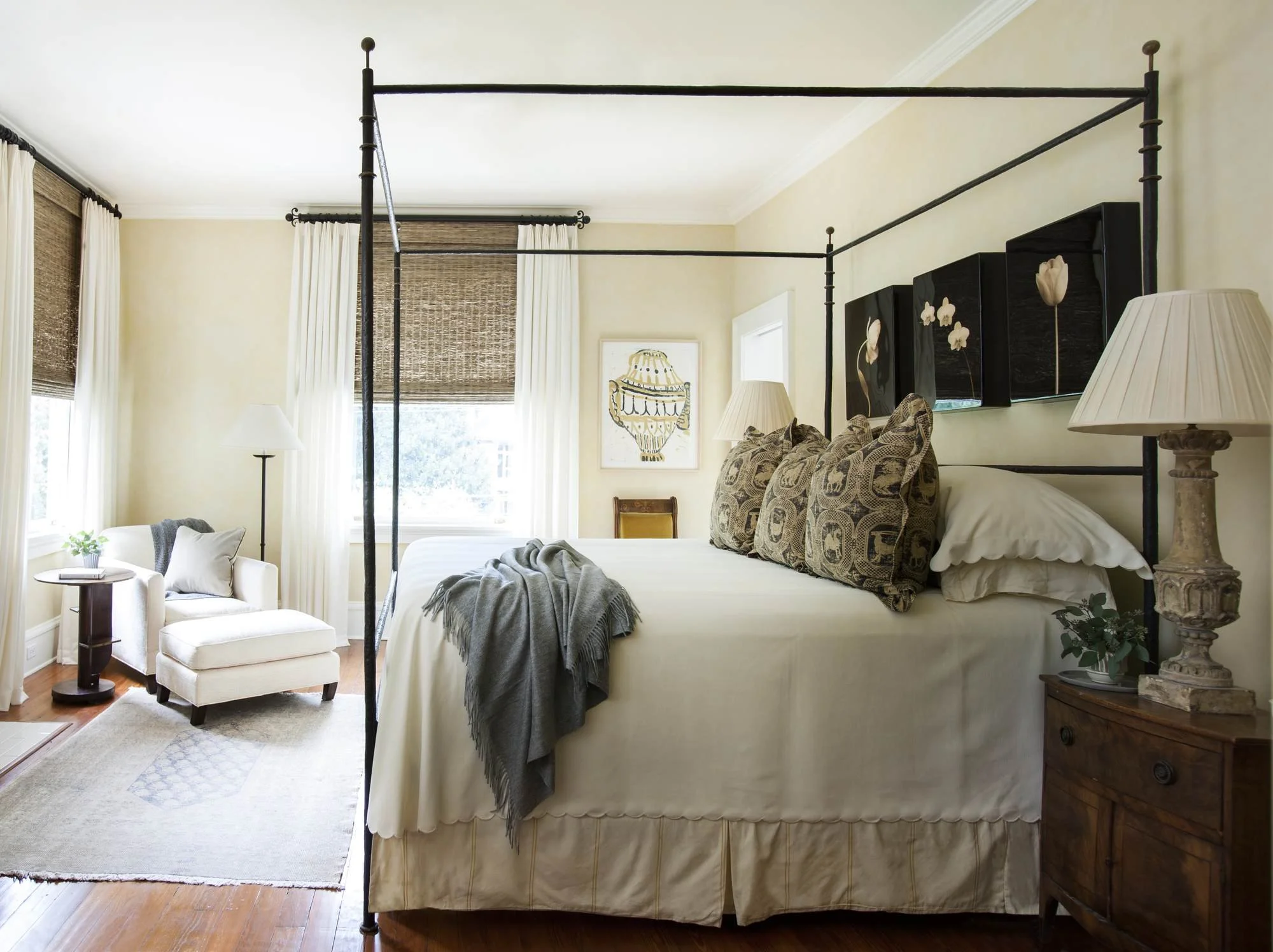 ansley-atlanta-residential-interior-design-primary-bedroom-iron-canopy-bed-woven-shades.jpg
