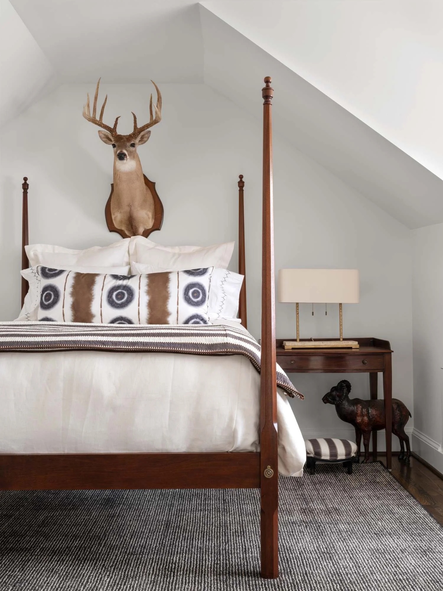 Peachtree-Battle-bedroom-four-poster-bed-deer-mount-sloped-ceiling.jpg