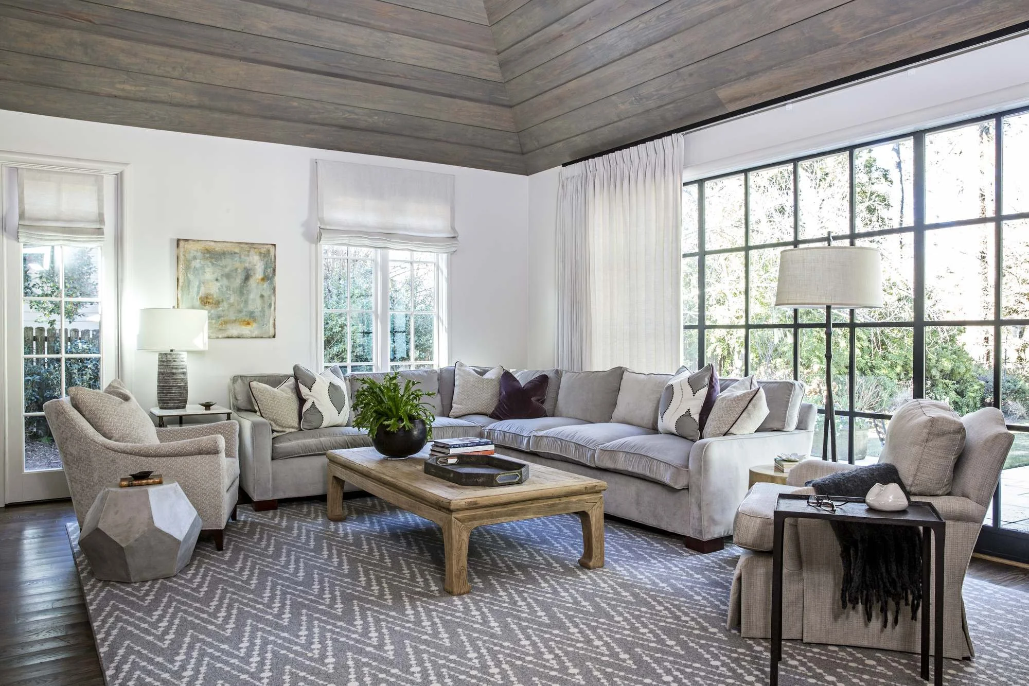 atlanta-living-room-curved-sectional-wood-plank-ceiling.jpg