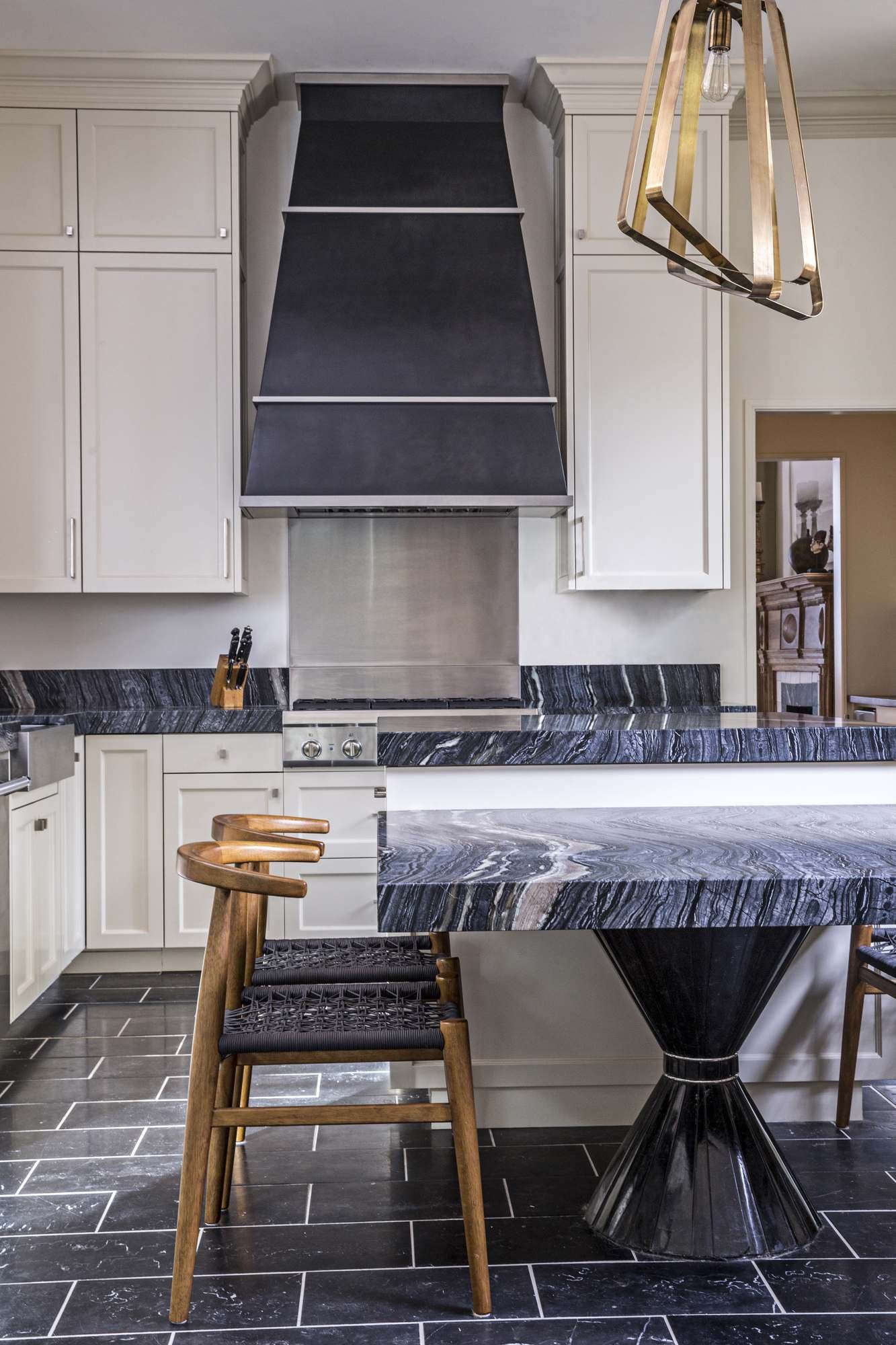 ansley-atlanta-residential-interior-design-kitchen-black-marble-island-brass-pendant.jpg