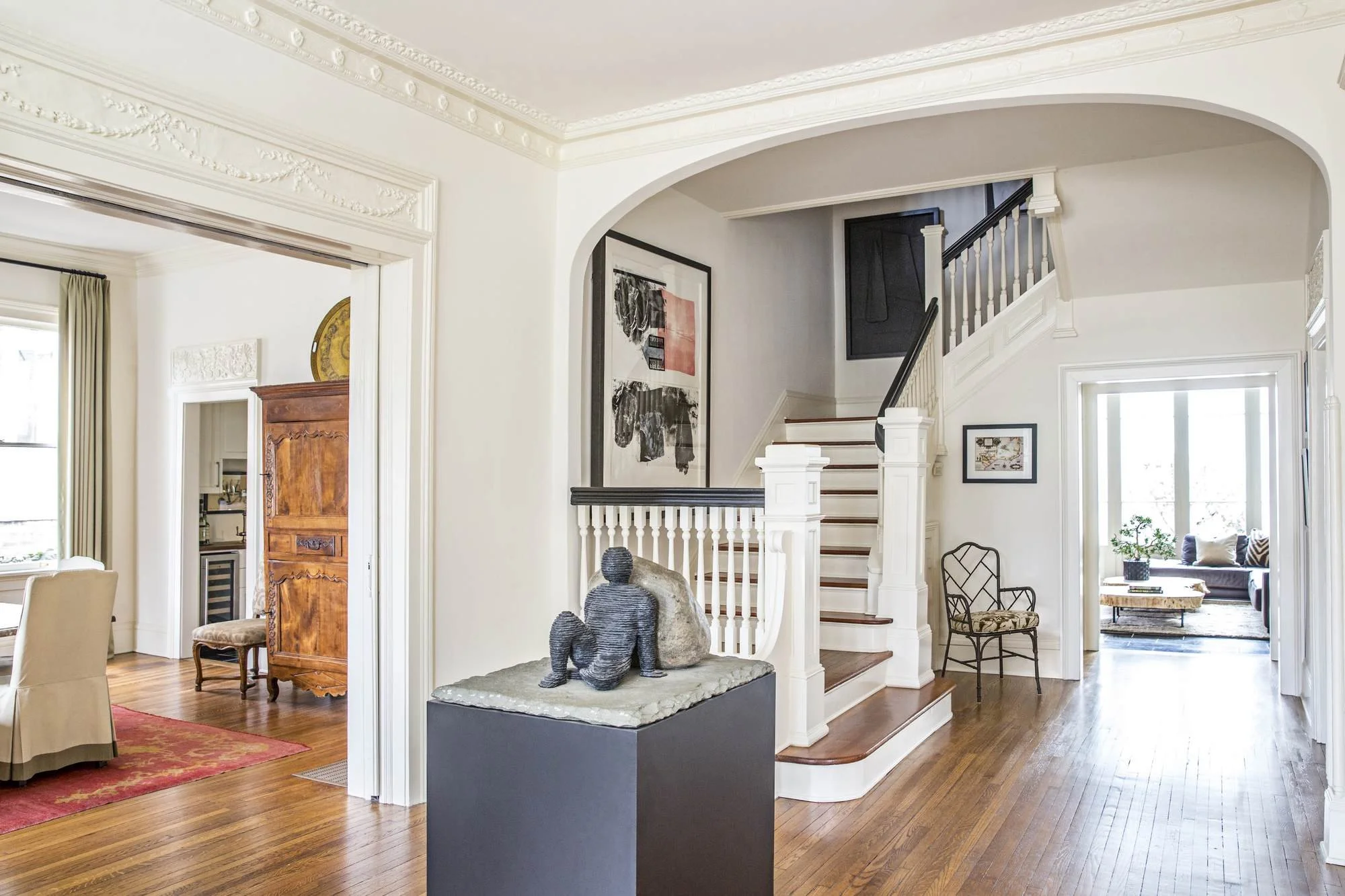 ansley-atlanta-residential-interior-design-foyer-staircase-sculpture-ornate-molding.jpg