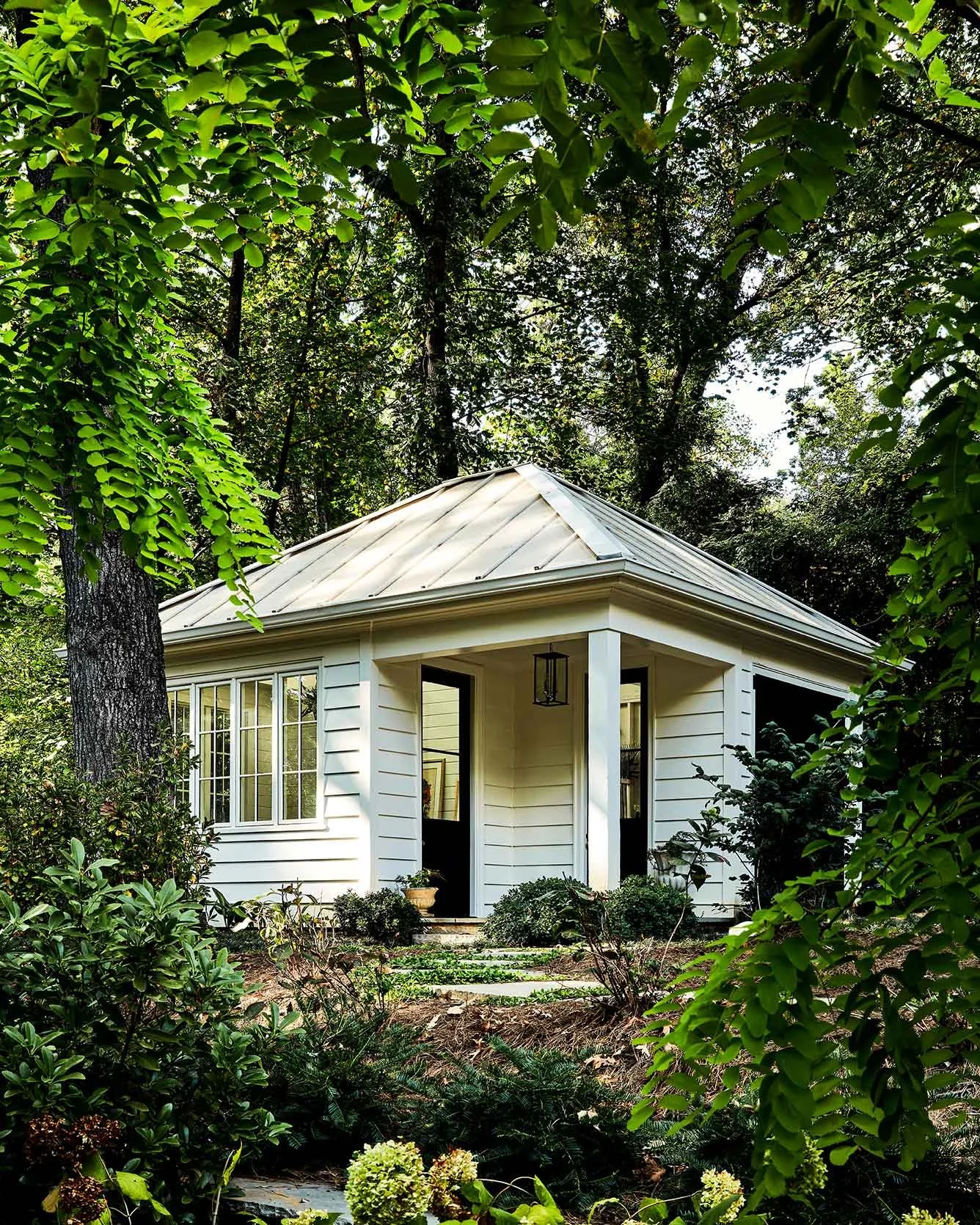 exterior-guest-house-atlanta-residential-interior-design-guest-house-exterior-wooded-garden.jpg