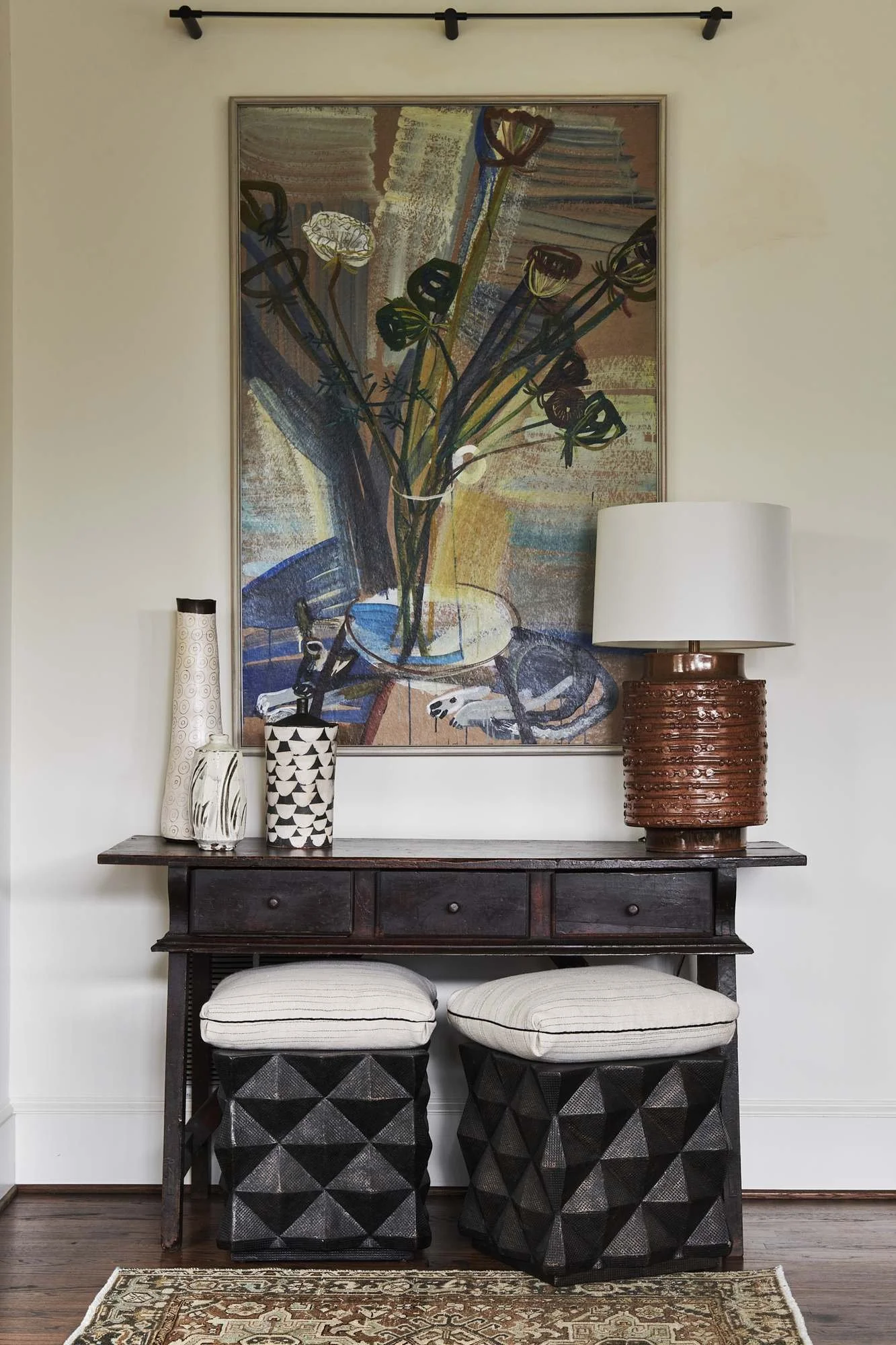 atlanta-luxury-interior-design-console-table-art-ottomans-vignette.jpg
