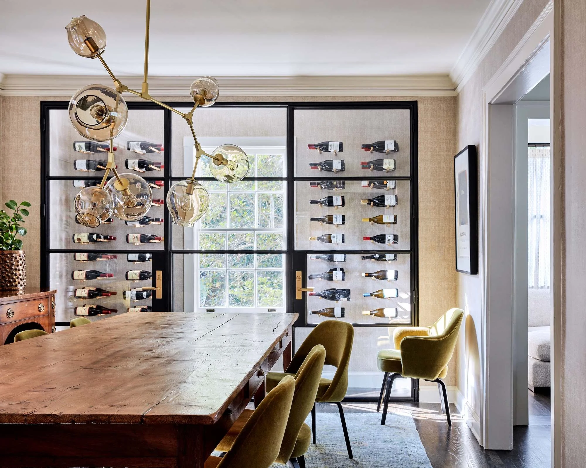 Woodward-Way-dining-room-glass-wine-wall-brass-globe-chandelier.jpg