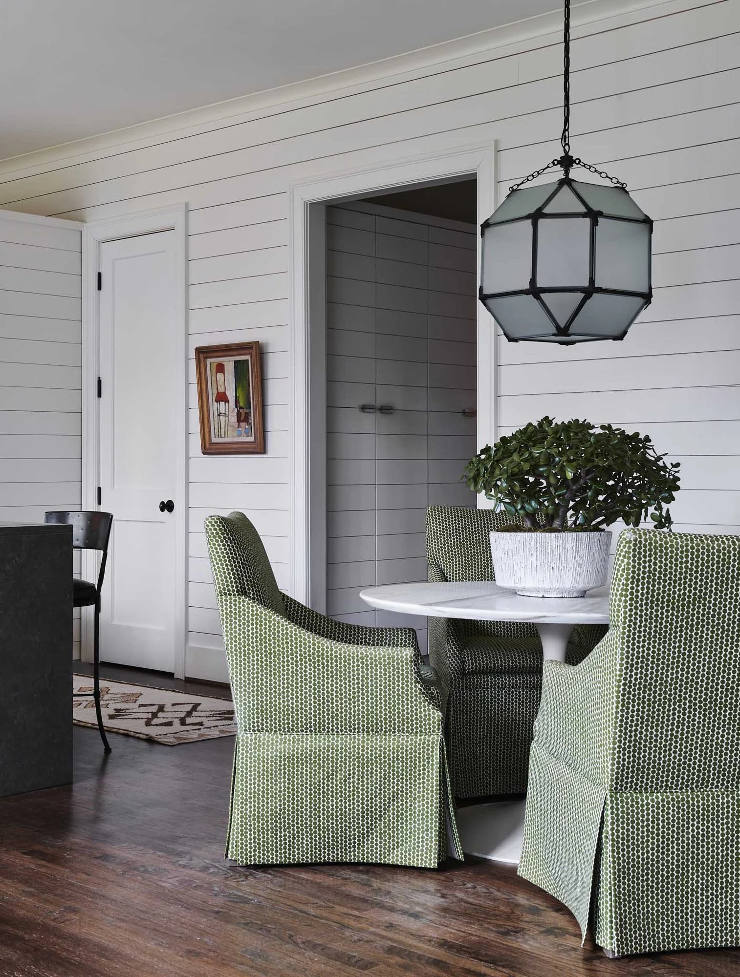atlanta-luxury-breakfast-nook-green-slipper-chairs-marble-table.jpg