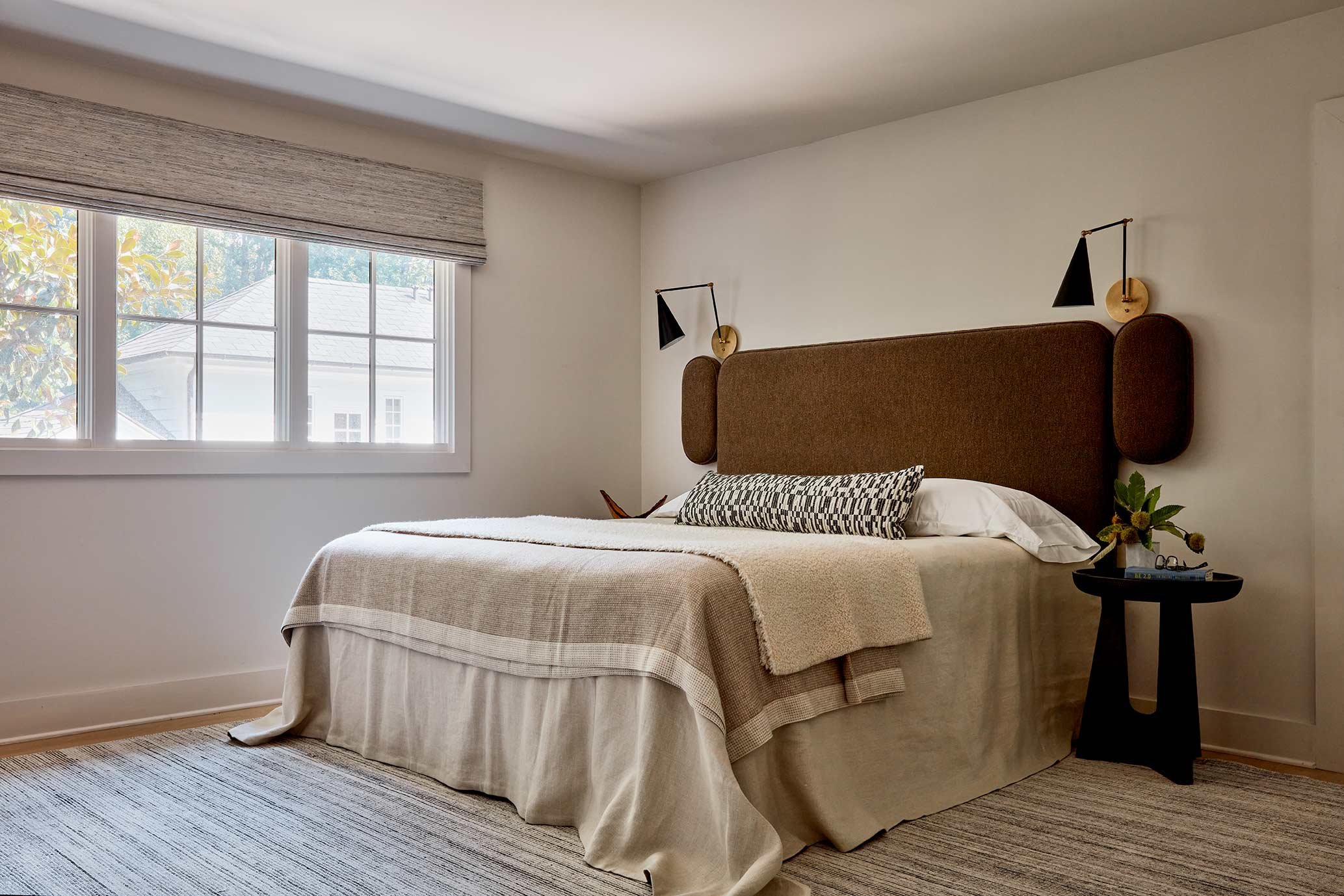 exterior-guest-house-atlanta-residential-interior-design-bedroom-upholstered-headboard-brass-sconces.jpg
