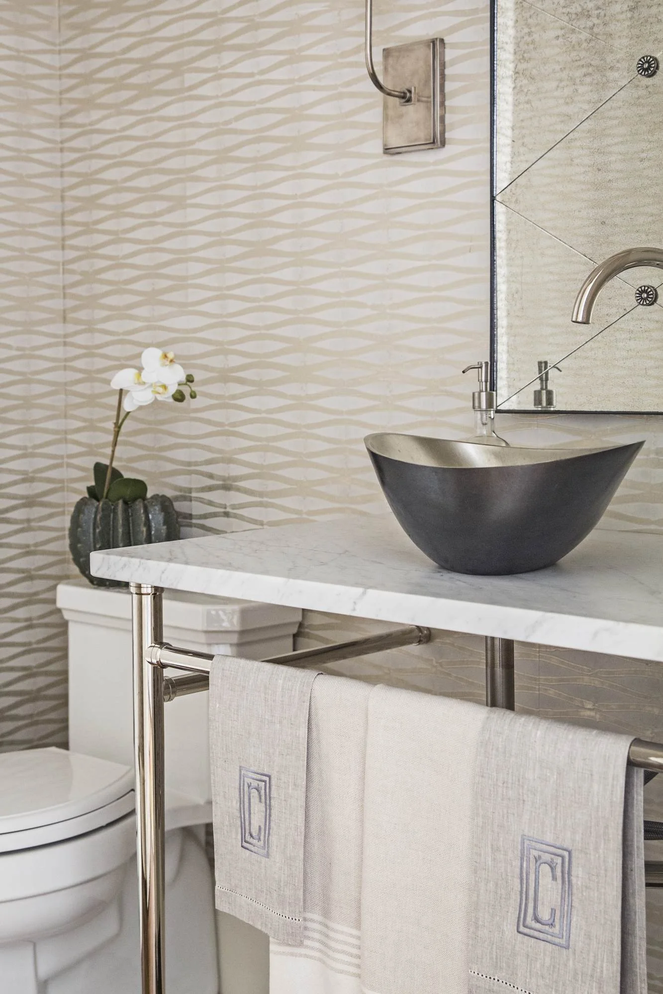 powder-room-vessel-sink-marble-console-wave-tile-wall.jpg