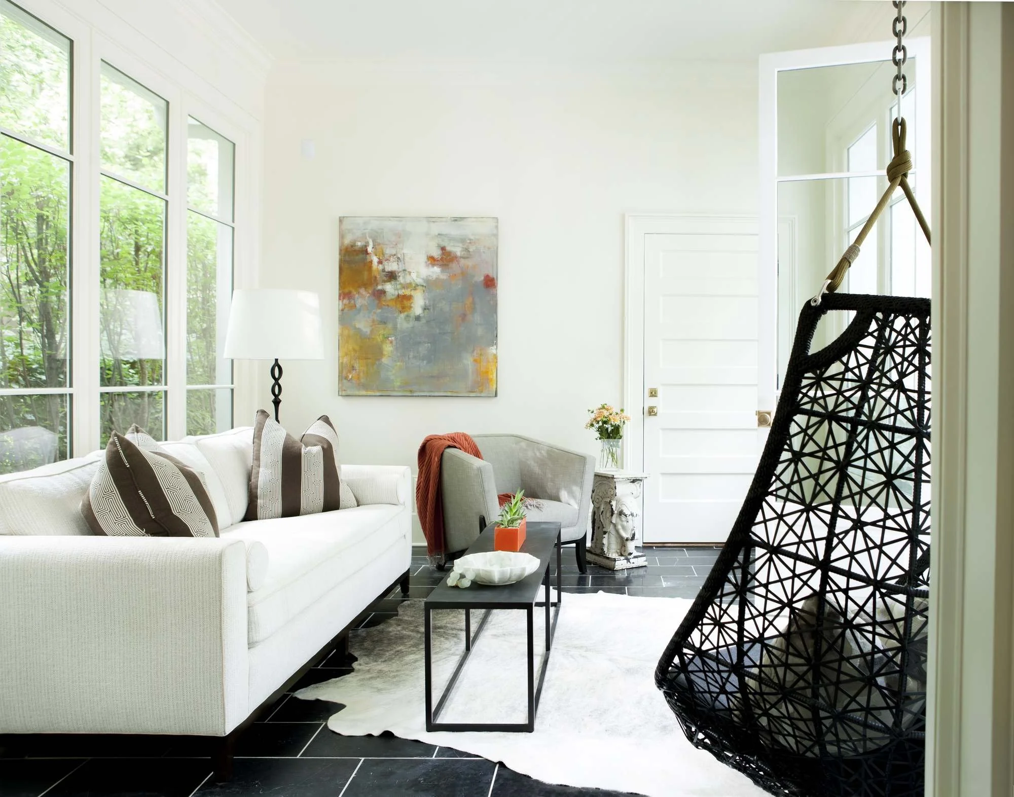 ansley-atlanta-residential-interior-design-sunroom-hanging-chair-abstract-art.jpg