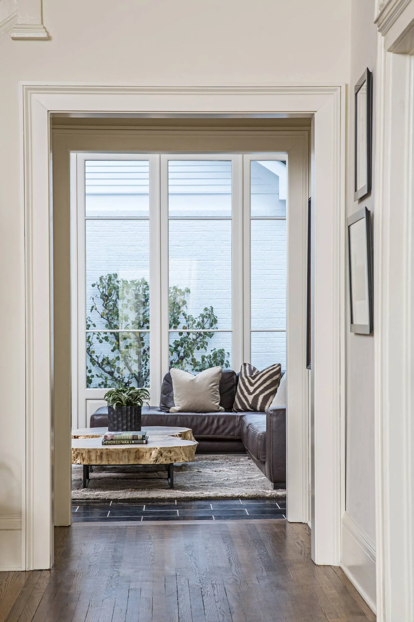 ansley-atlanta-residential-interior-design-hallway-view-sunroom-live-edge-table.jpg