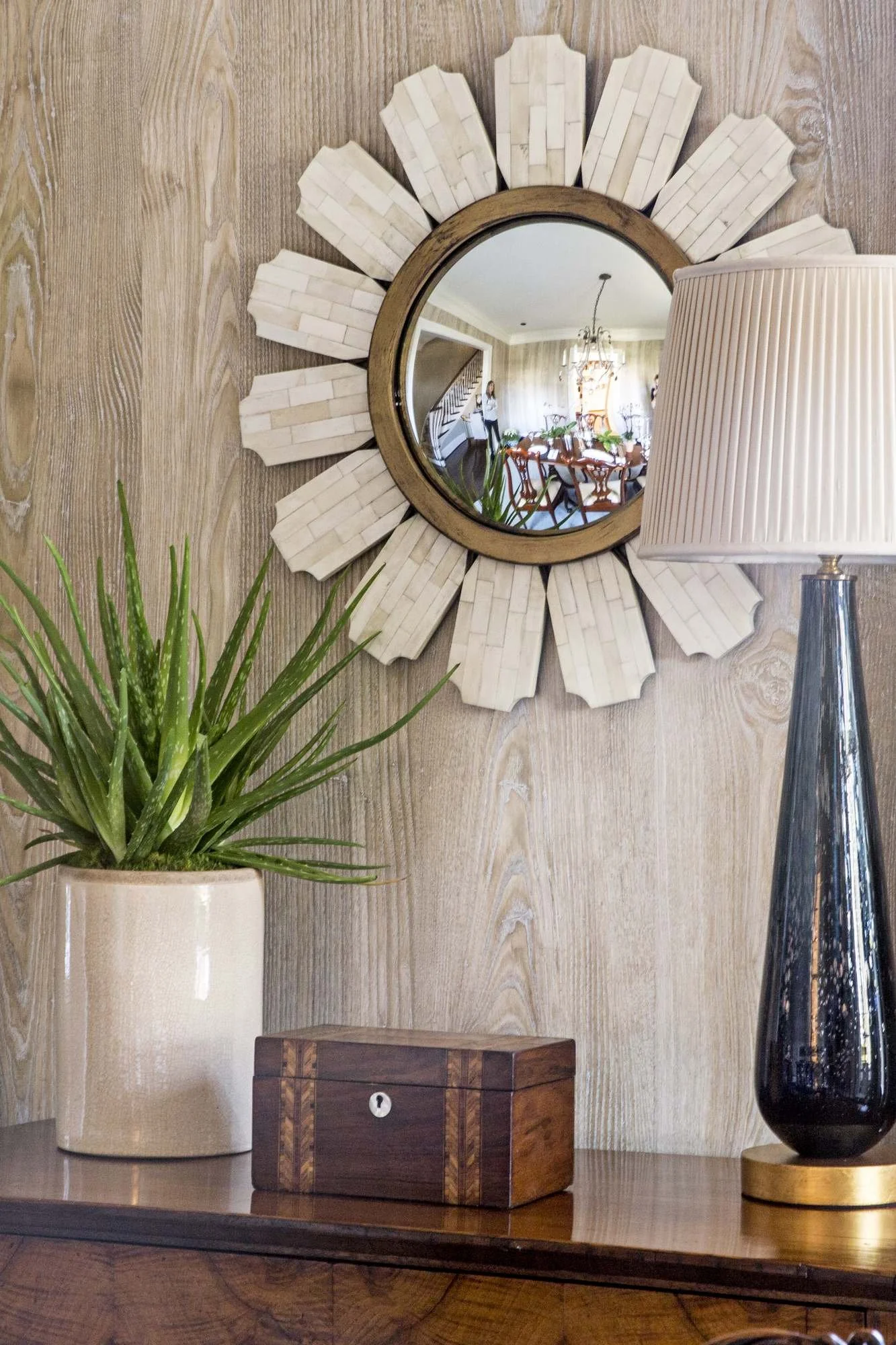 cofield-atlanta-residential-interior-design-dining-room-sunburst-mirror-vignette-grasscloth-detail.jpg