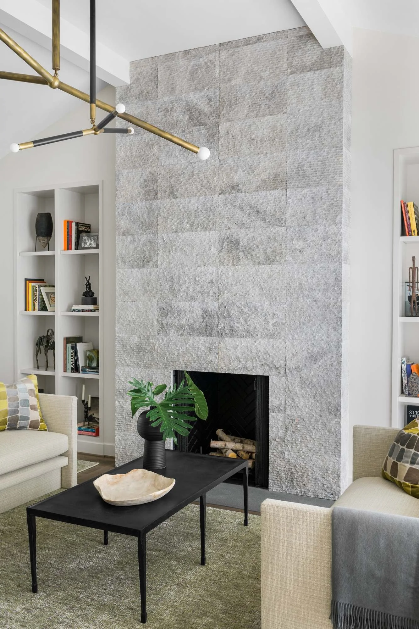 millwalk-atlanta-residential-interior-design-living-room-stone-fireplace-built-ins-brass-chandelier.jpg