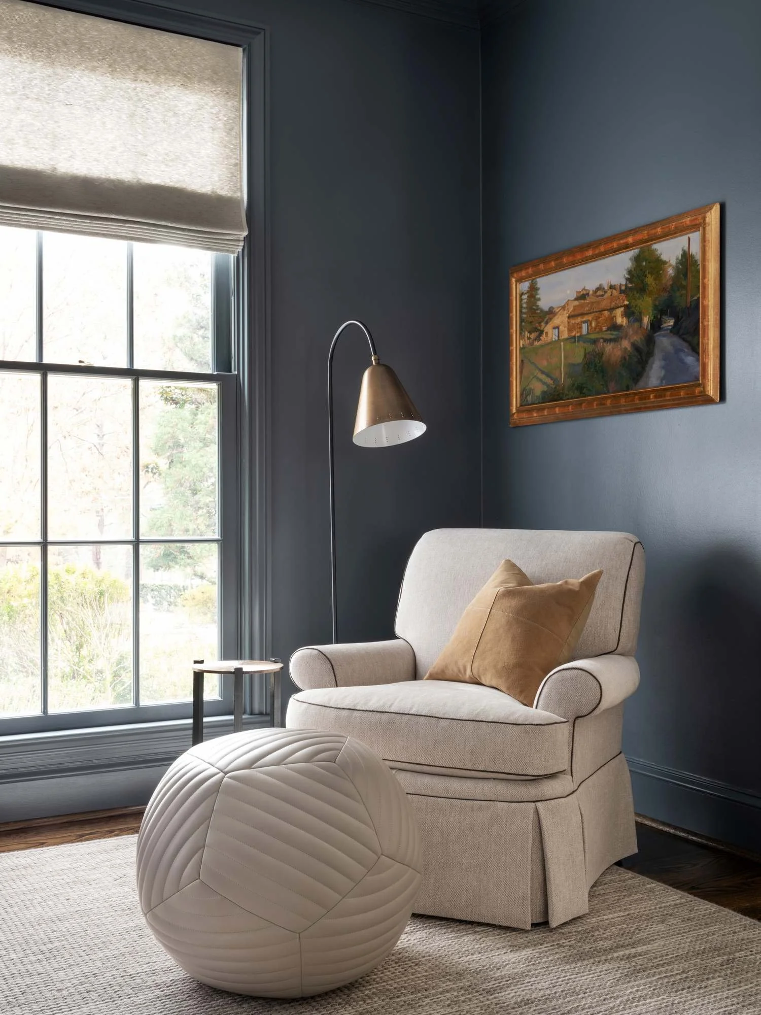 Peachtree-Battle-reading-nook-navy-walls-linen-chair-sculptural-ottoman.jpg