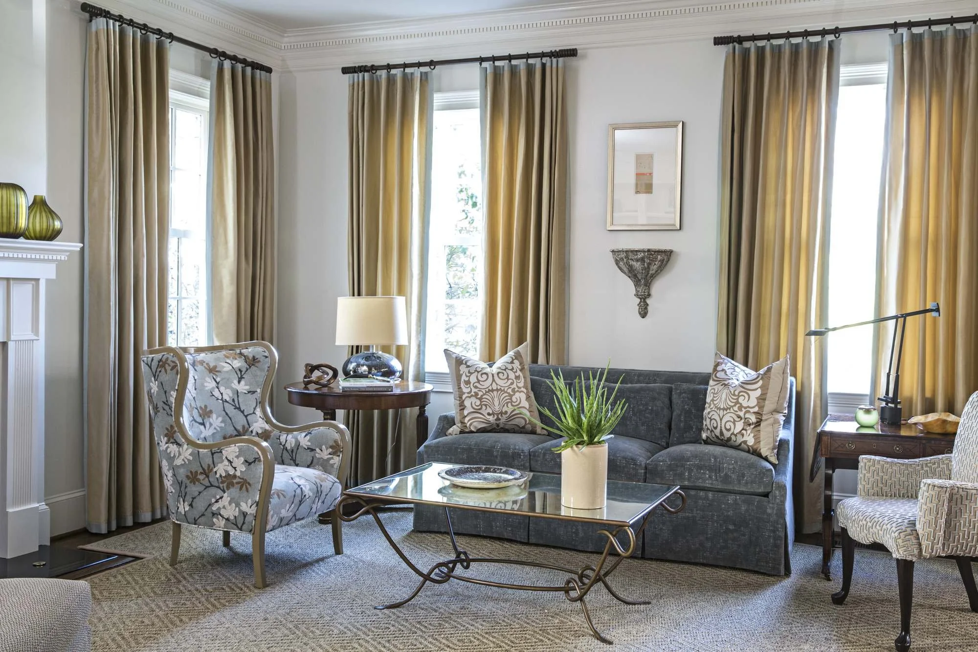 cofield-atlanta-residential-interior-design-living-room-gold-drapes-floral-chair-velvet-sofa.jpg