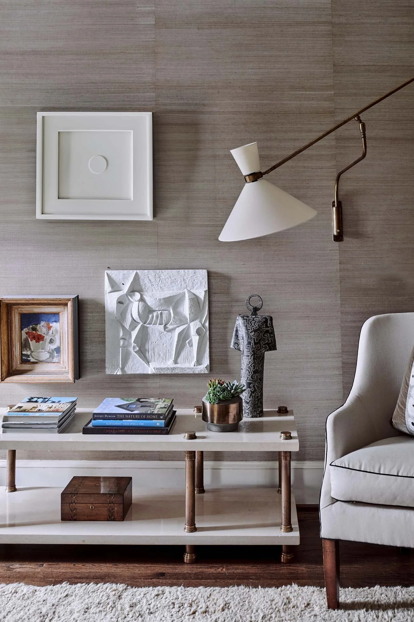 atlanta-luxury-bedroom-vignette-art-shelf-brass-swing-arm-lamp.jpg