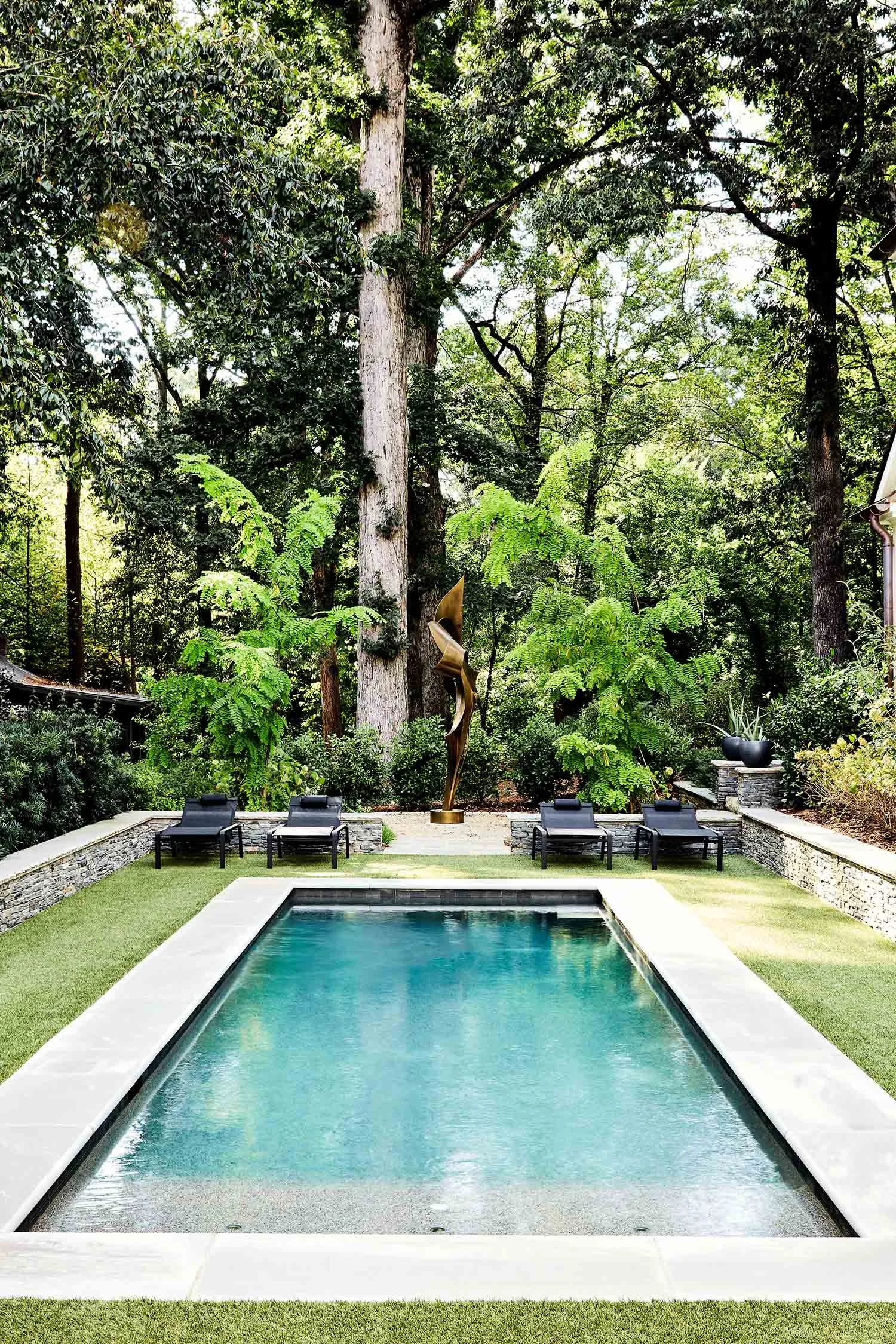 exterior-guest-house-atlanta-residential-interior-design-pool-bronze-sculpture-lounge-chairs.jpg