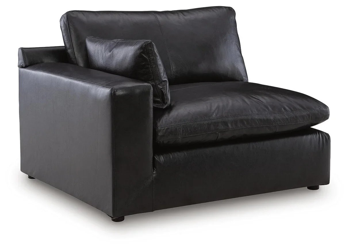 Modern modular leather sofa with top-grain leather seating, feather-fiber cushions, bolster pillows, and flexible three-piece configuration.