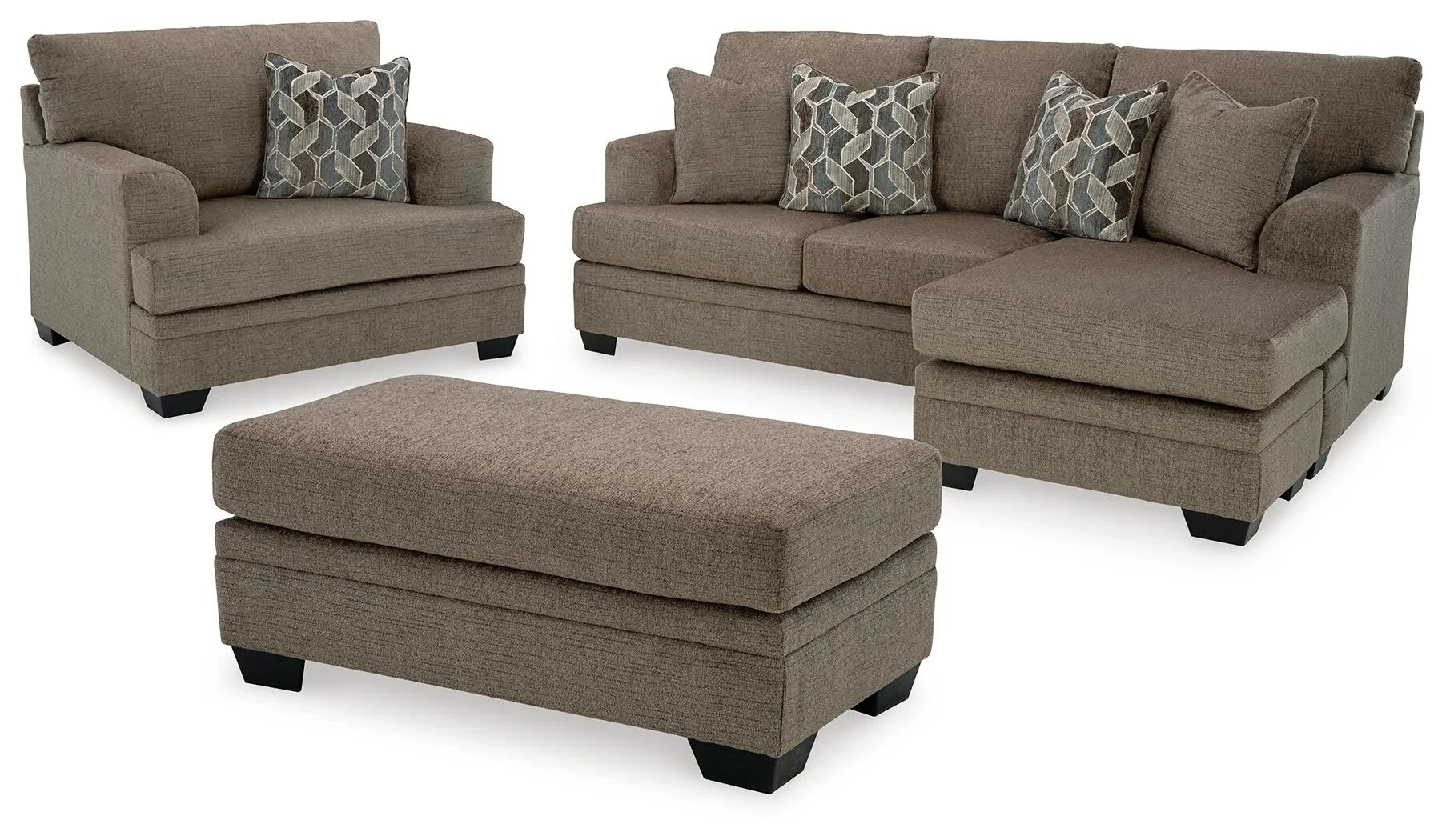 Sienna sofa collection with a reversible sofa chaise, oversized chair, and matching ottoman on a white background.